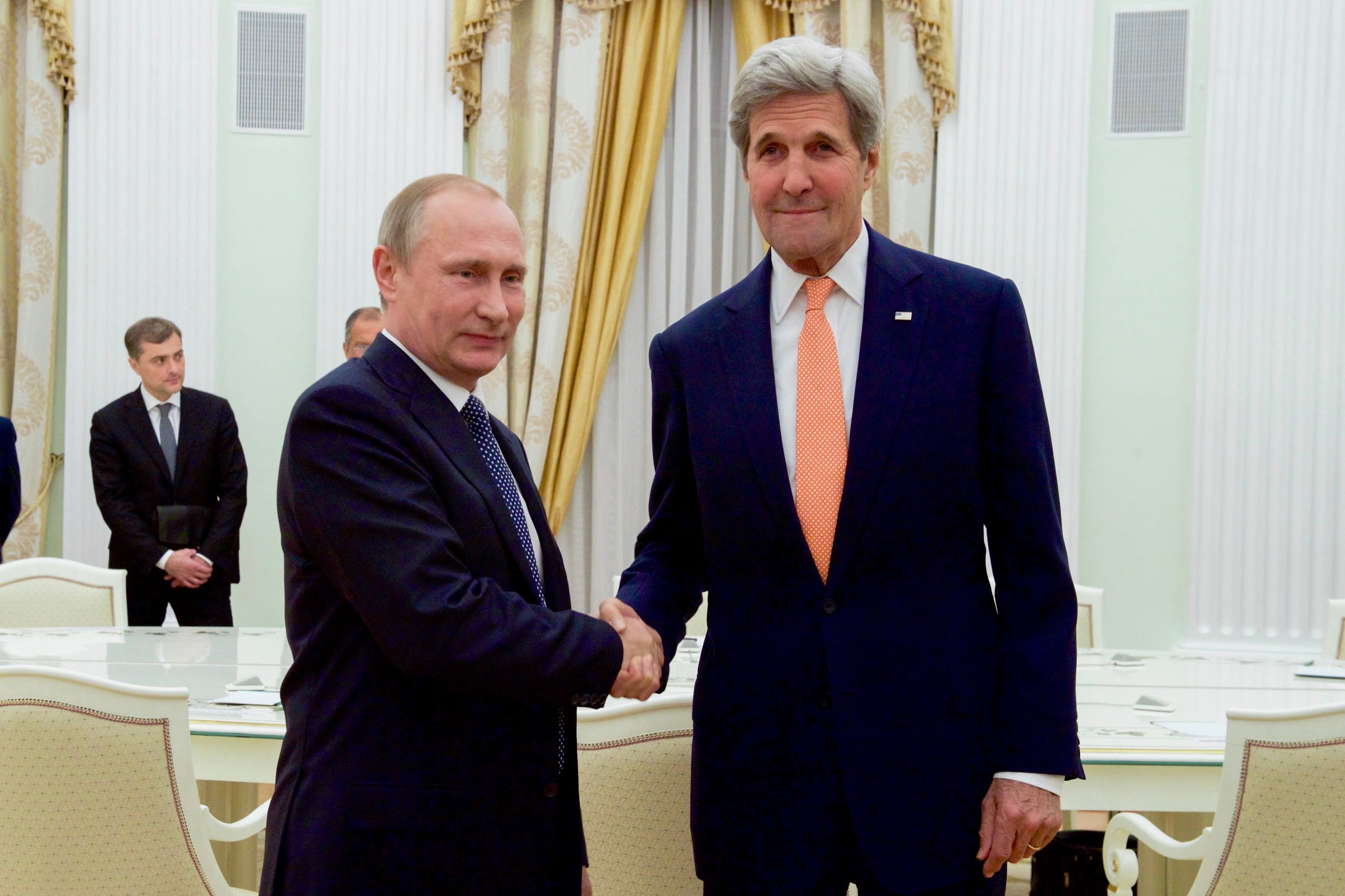 A handshake for the cameras before their bilateral meeting.