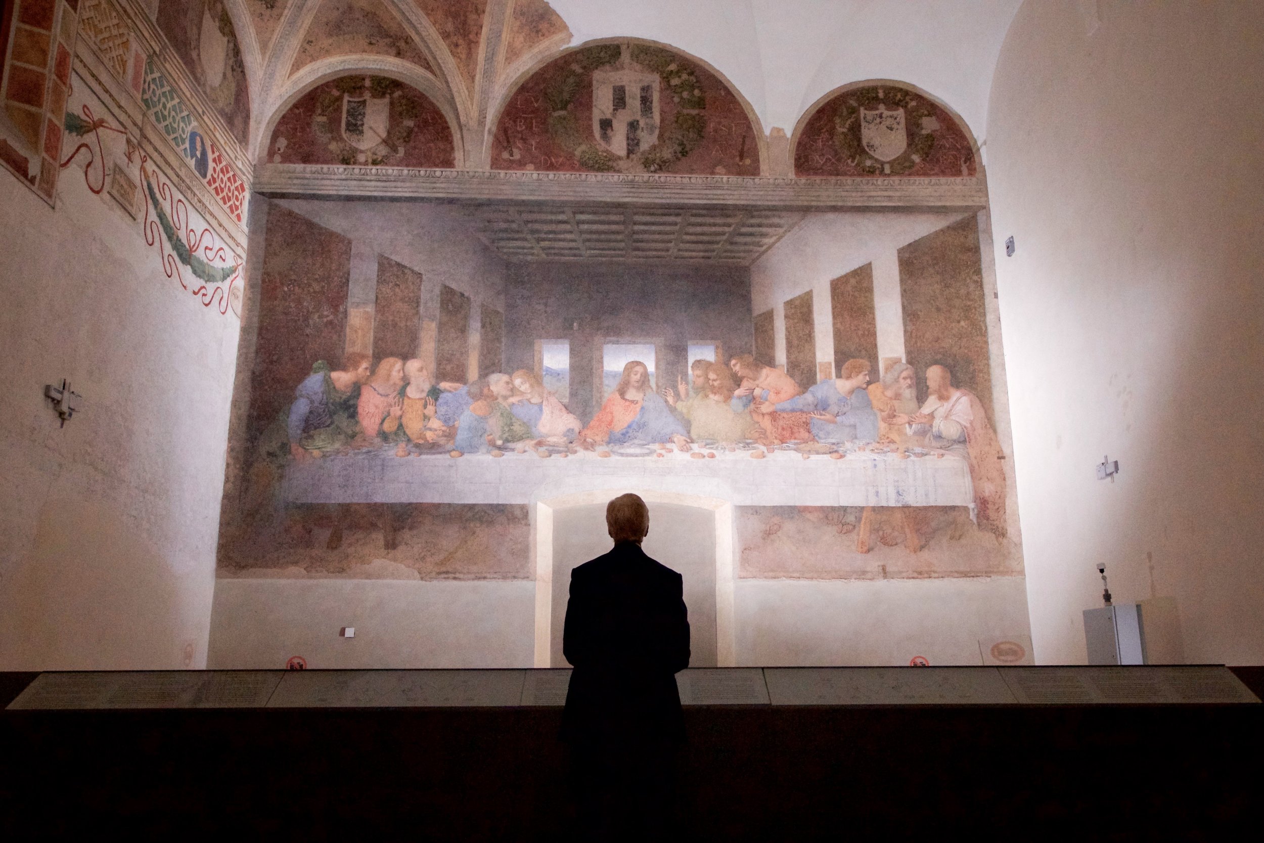  Surveying Leonardo’s  Last Supper  during a break in meetings in Milan, Italy. 