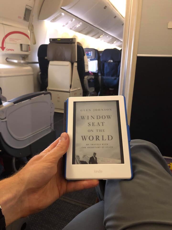  A D.S. agent shows his reading material en route to an assignment in Brussels, Belgium. 