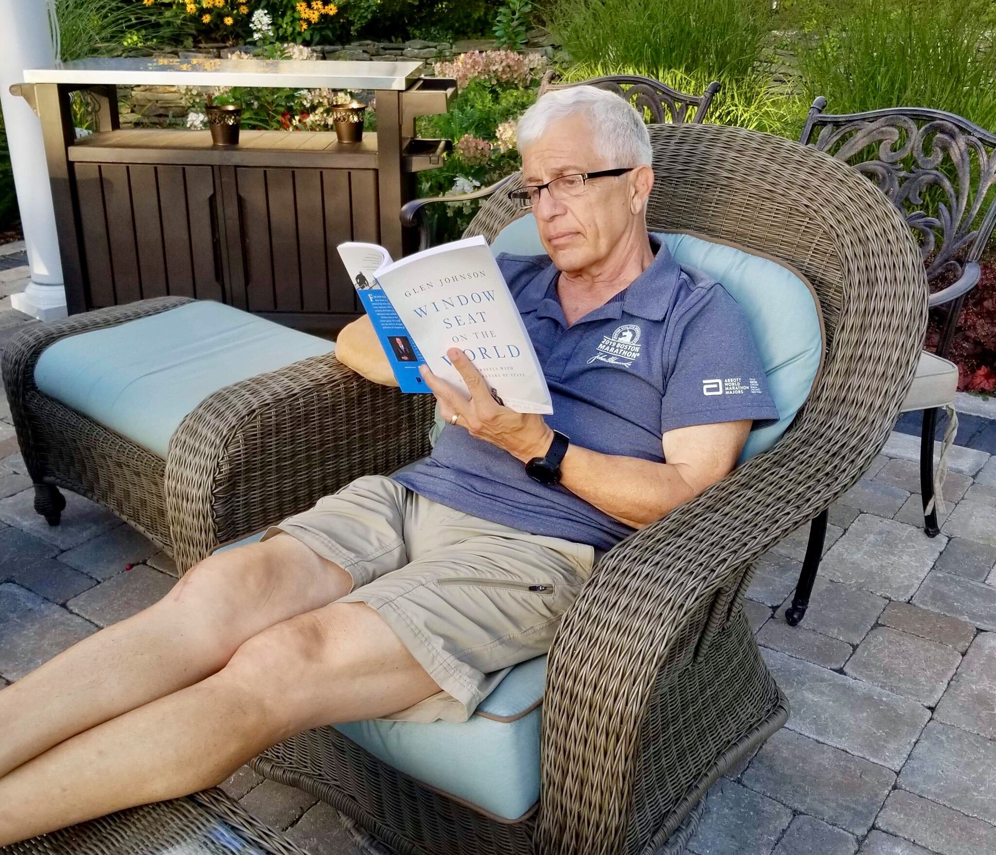  My former neighbor Tom Licciardello reads one of the two copies he bought in North Andover, Mass. 
