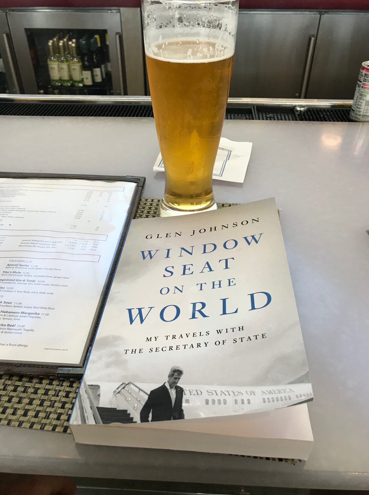  Our friend Eric Josephs helps sell copies to his fellow patrons as he awaits a flight at Logan Airport in Boston. 