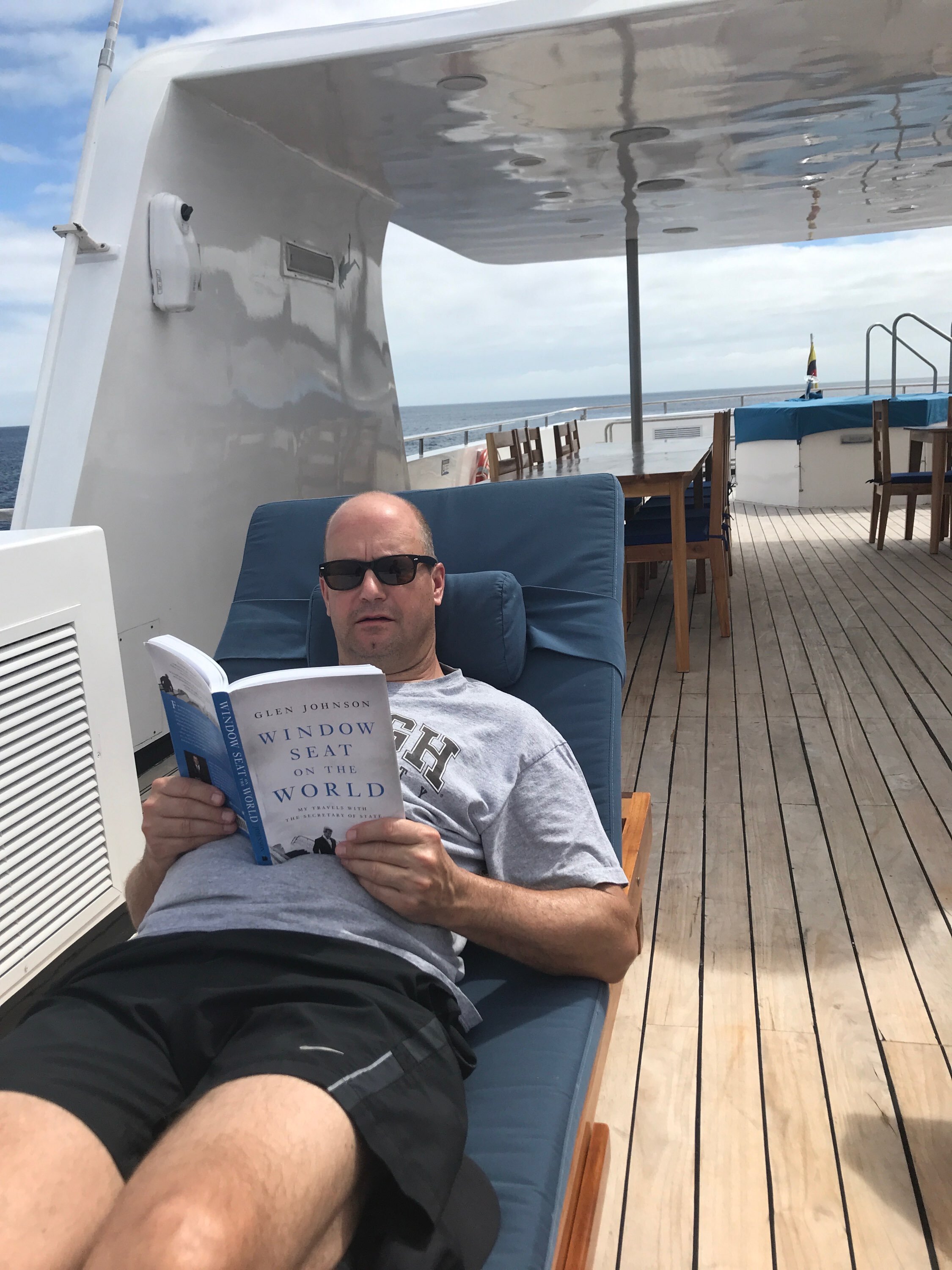  My college buddy Chris Coogan reading the book on a boat off the Galapagos Islands. 