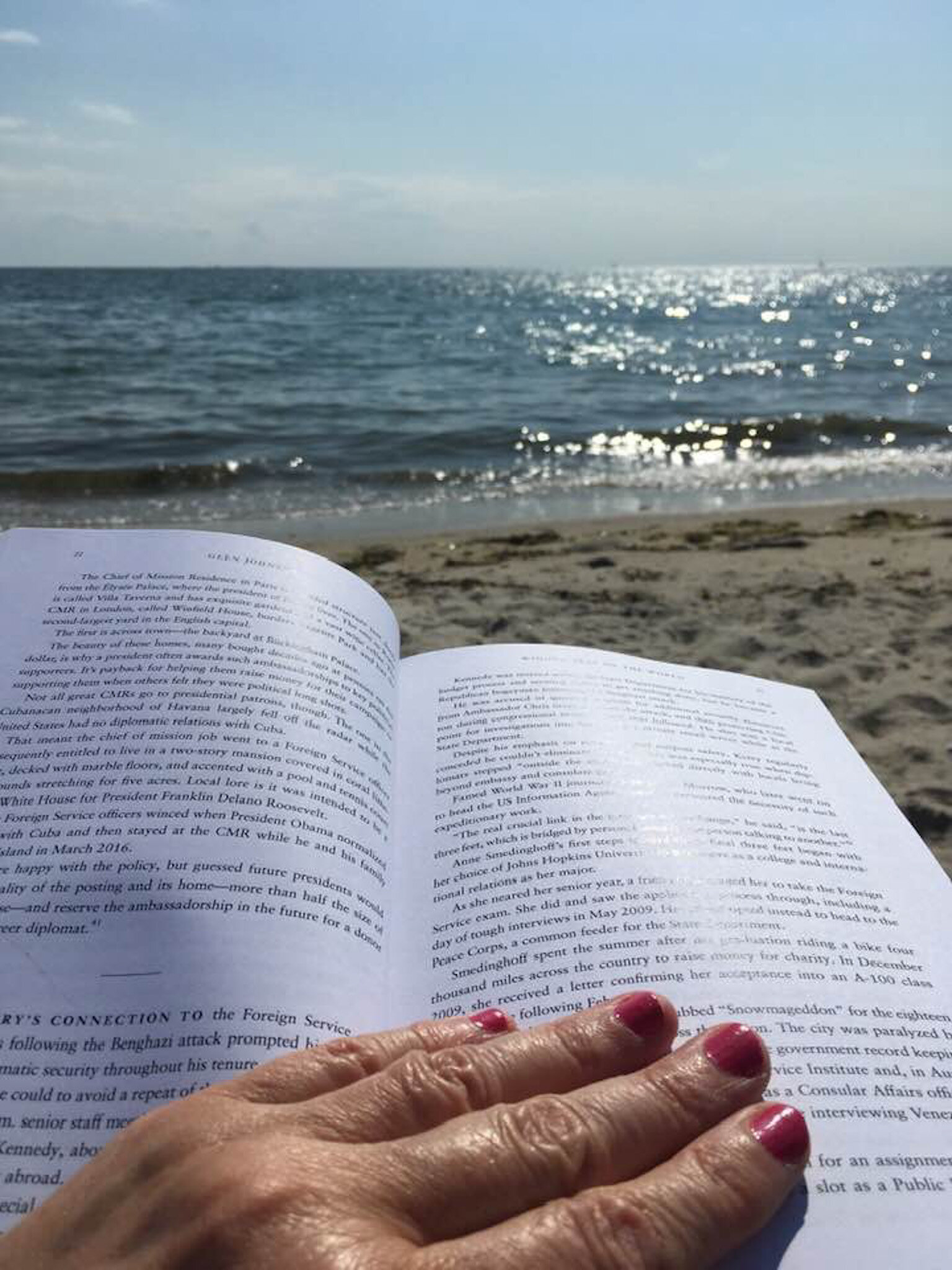  My wife’s longtime friend Elaine Crossley, reading the book at Groton Long Point, Ct. 