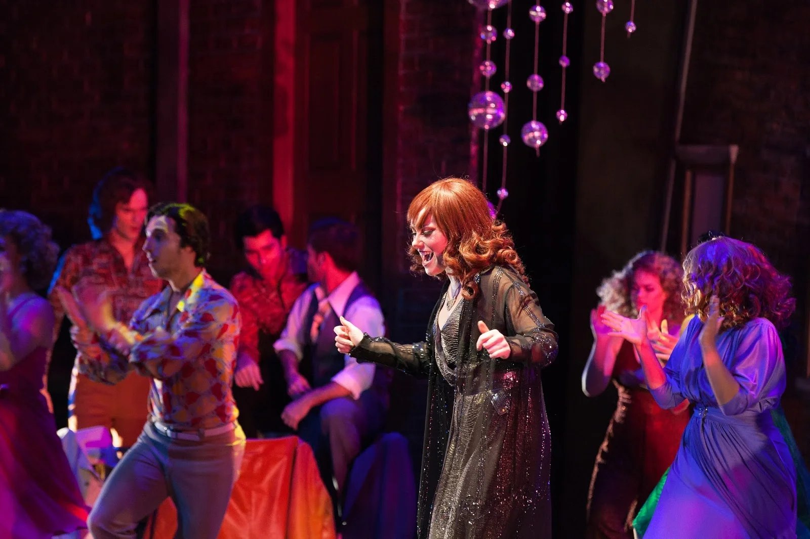 Candy (Katie Hart) belts out a song in ABT's production of Saturday Night Fever.jpg