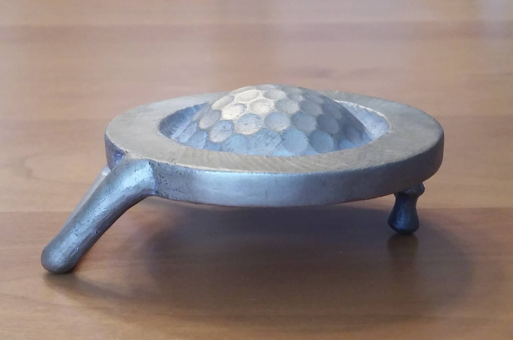 Original bronze casting of the Hole in One Buckle.