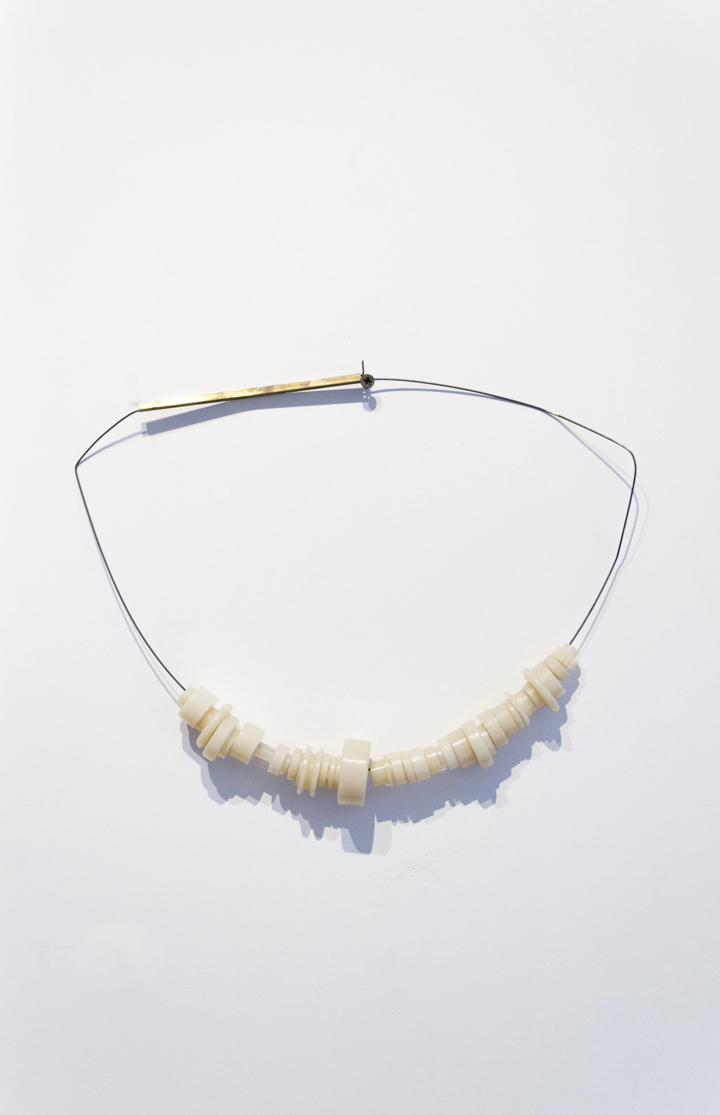 Sarah Entwistle, Spolia necklace #3, 2018, Sprung steel wire, erasers from the archive, Dimensions variable