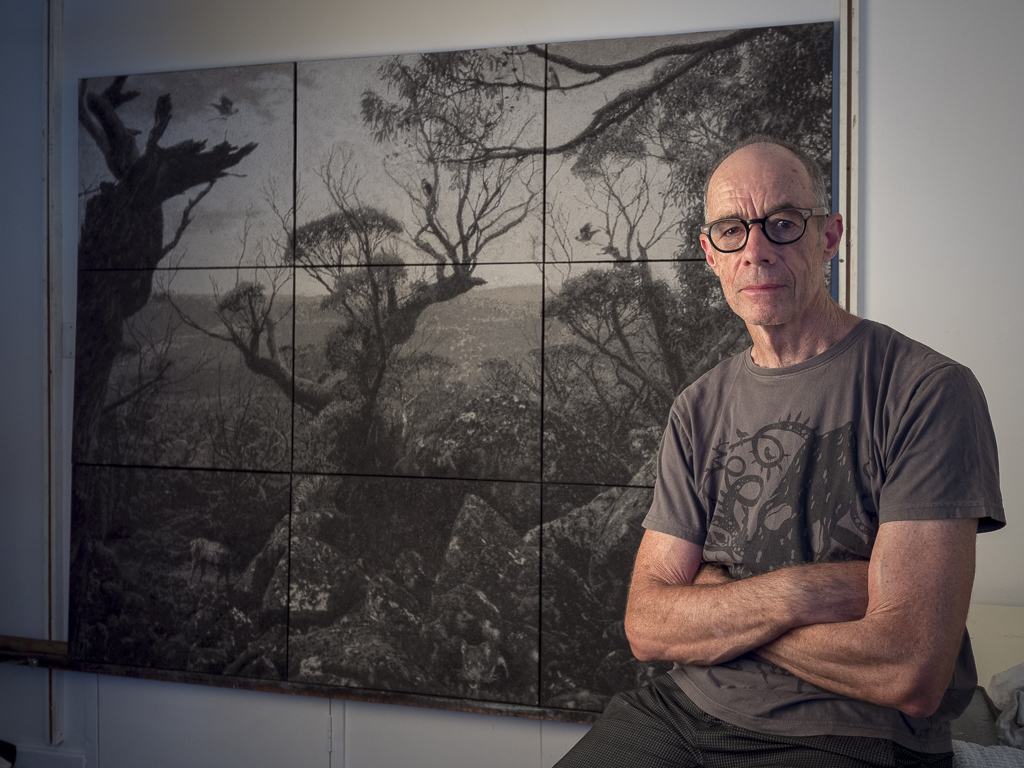 Nigel Hewitt in front his work Ghosts on the Tarn Shelf, Photograph by Bewley Shaylor