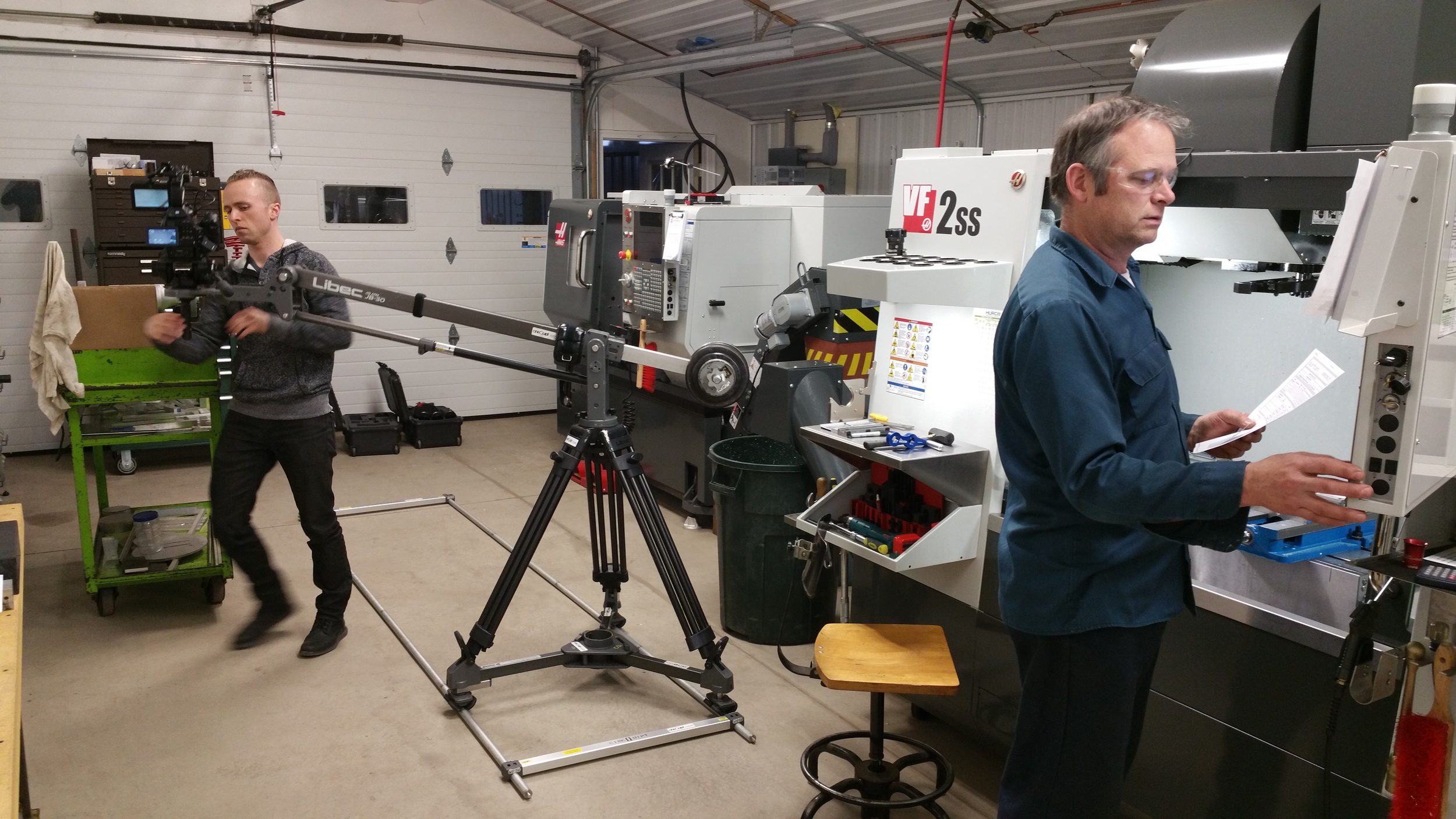 Stan prepping the CNC mill to machine some aluminum cores while Zachary gets ready to shoot some video in the shop.