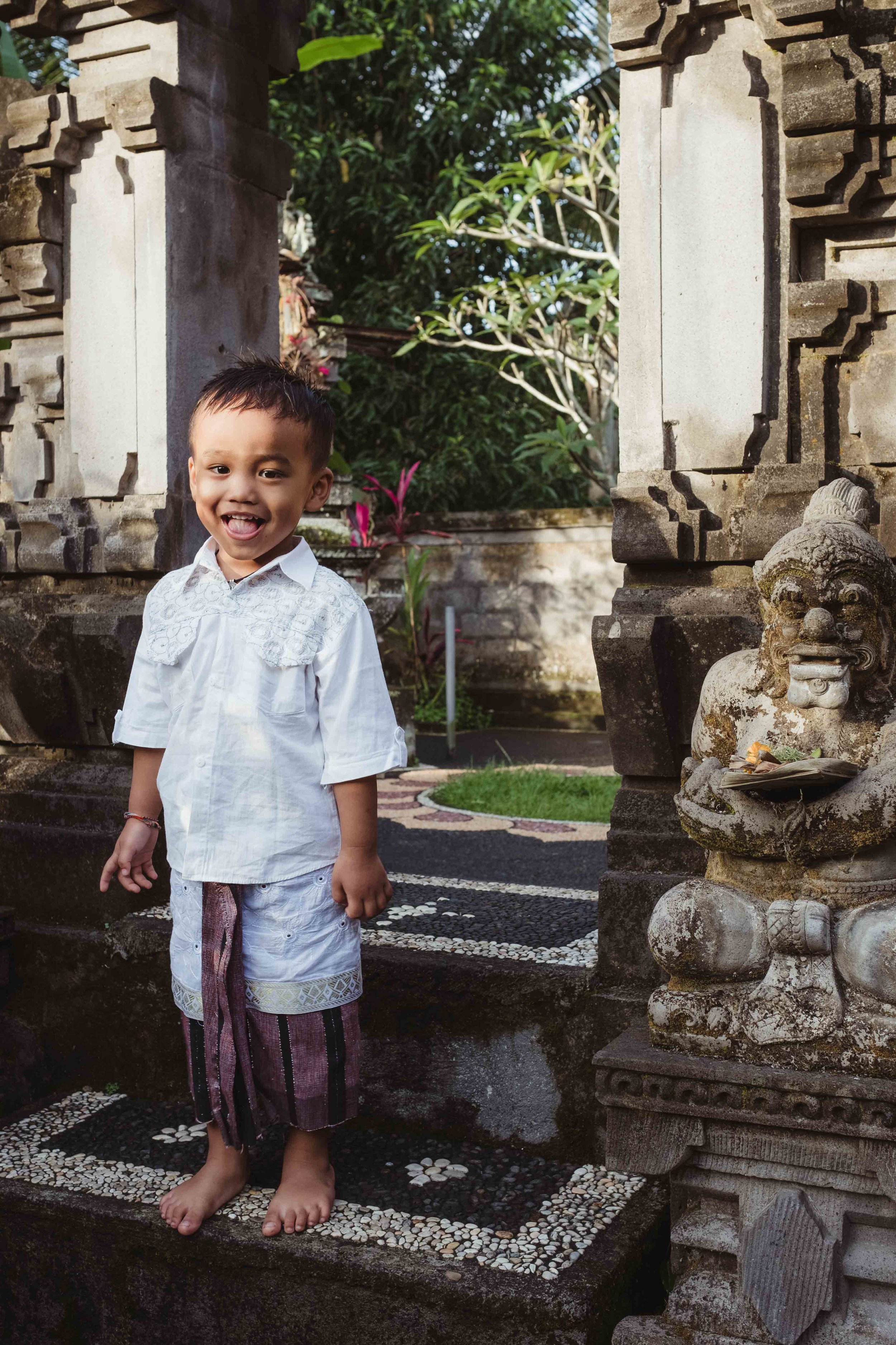 boy outside family temple