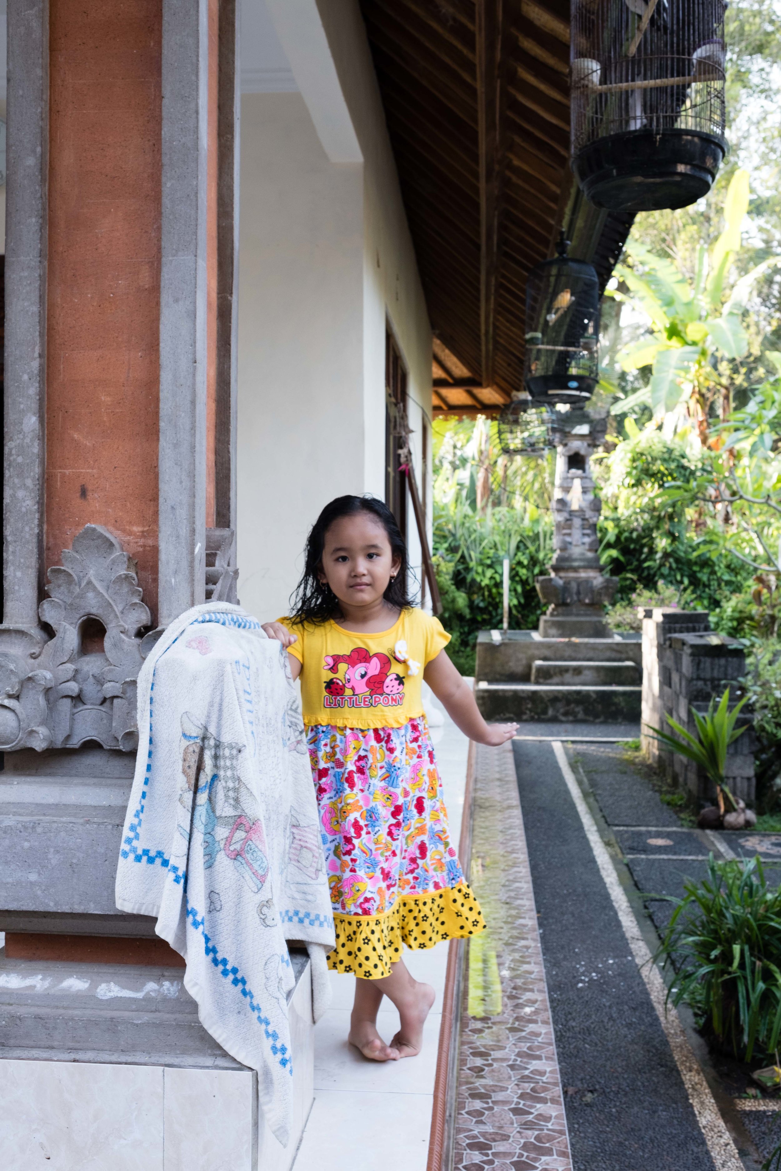 Little girl outside family home