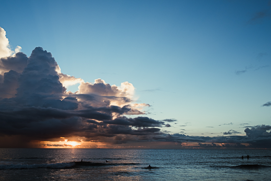 Surfers enjoy the fading glory...and wait.