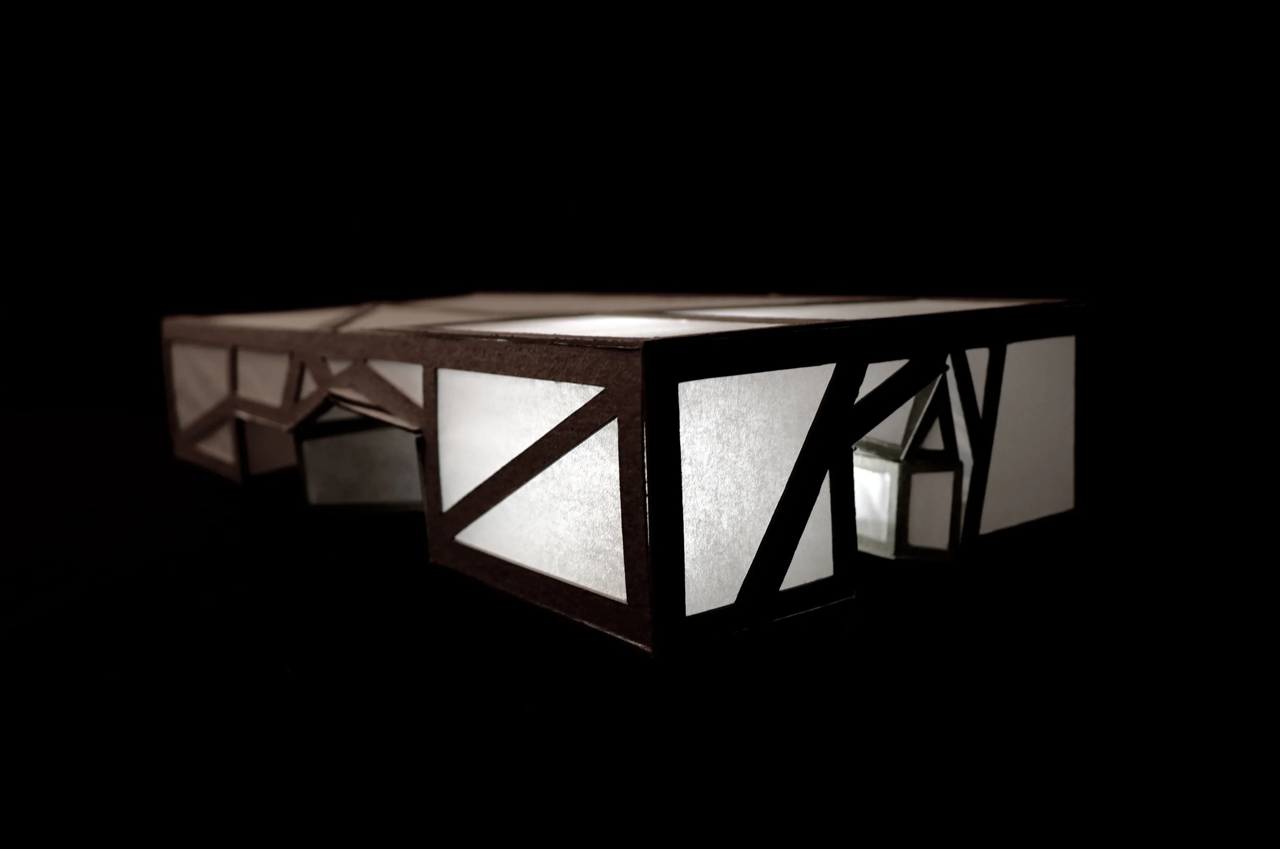 Photovoltaic panels on the concrete beams along the roof collect energy throughout the daylight. During the night, motion activated sensors light up the structure's panels to create safety and an interactive environment.