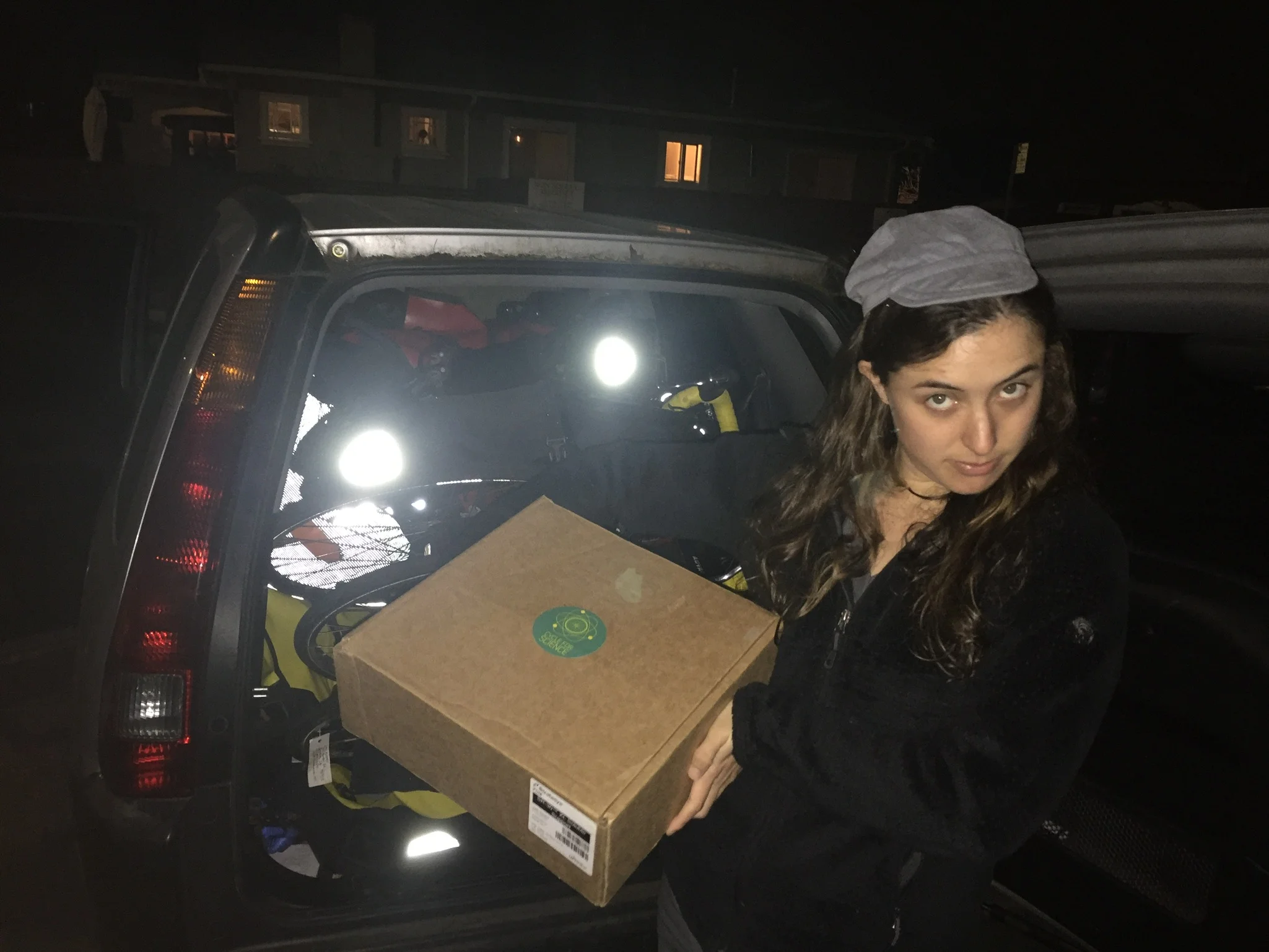 A vagabond we found on da streetz posing with our stash of bicycles and Sol Cycle box.
