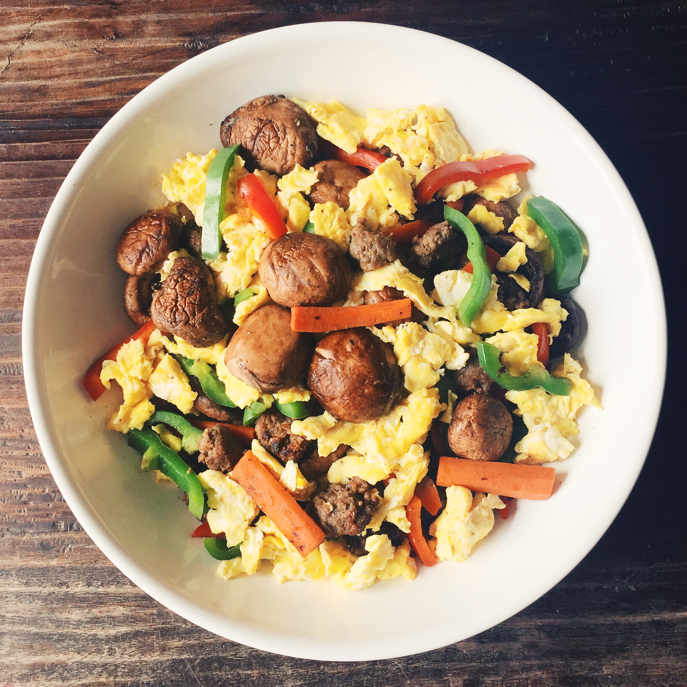 Leftover veggies over scramble eggs for breakfast