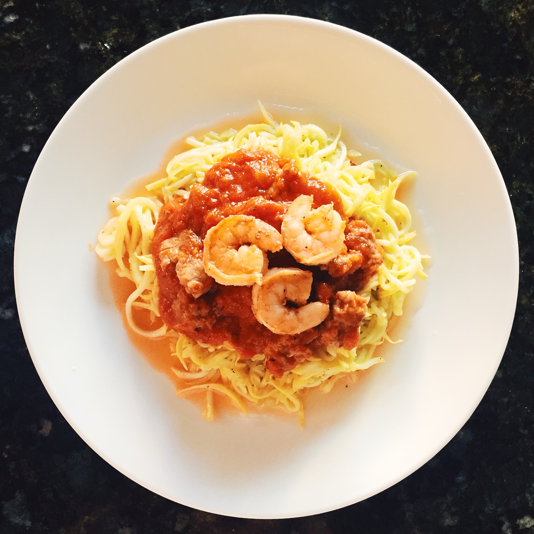 Yellow squash with marinara sauce and grilled shrimp. I stir fry squash noodles then add sauce and grilled shrimp on top. I don't like to eat before my workout so I made this dish as a late breakfast and early lunch. Great way to refuel!