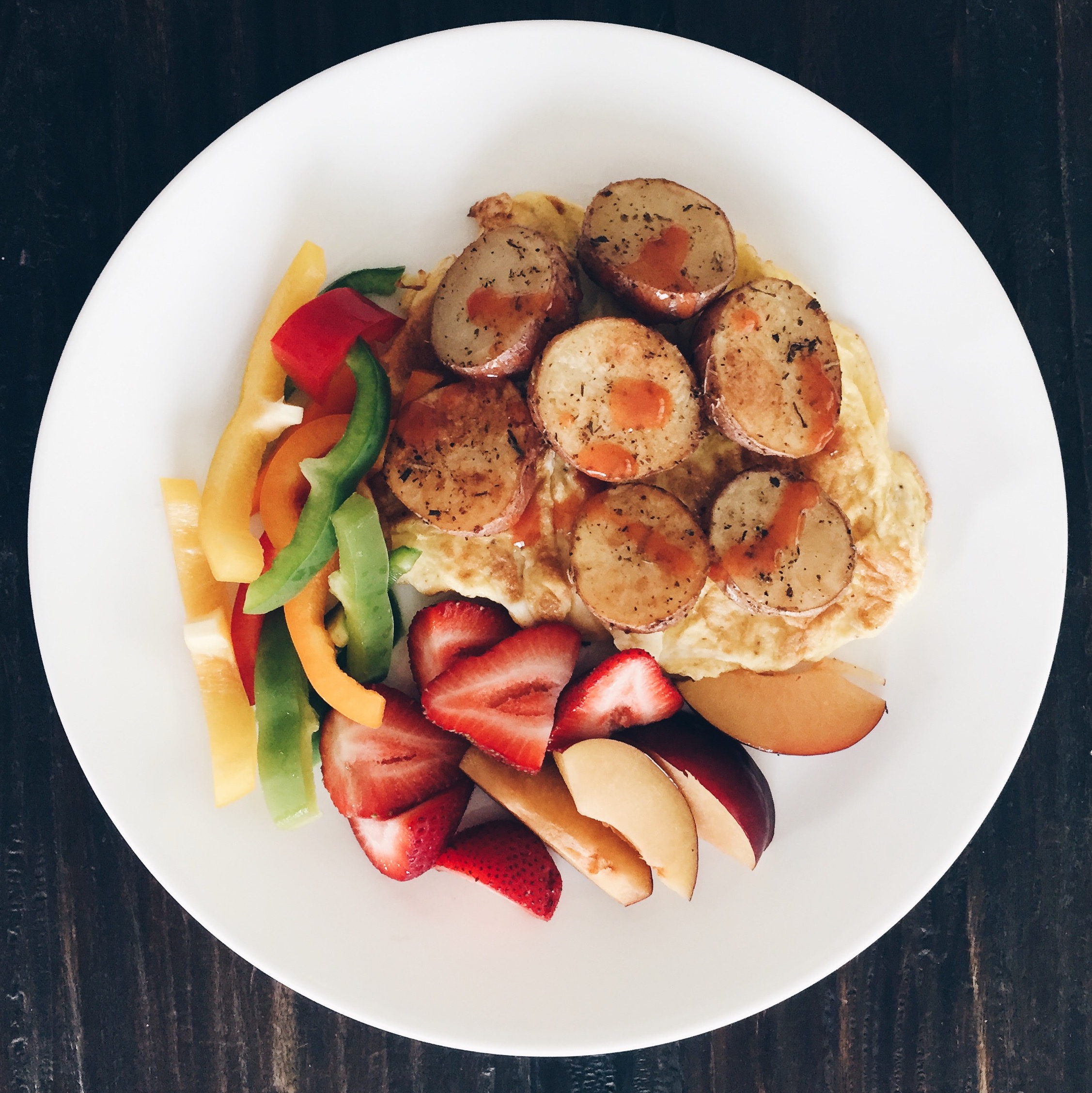 This is my very easy scrambled eggs with roasted potatoes, fruit, and veggies. 