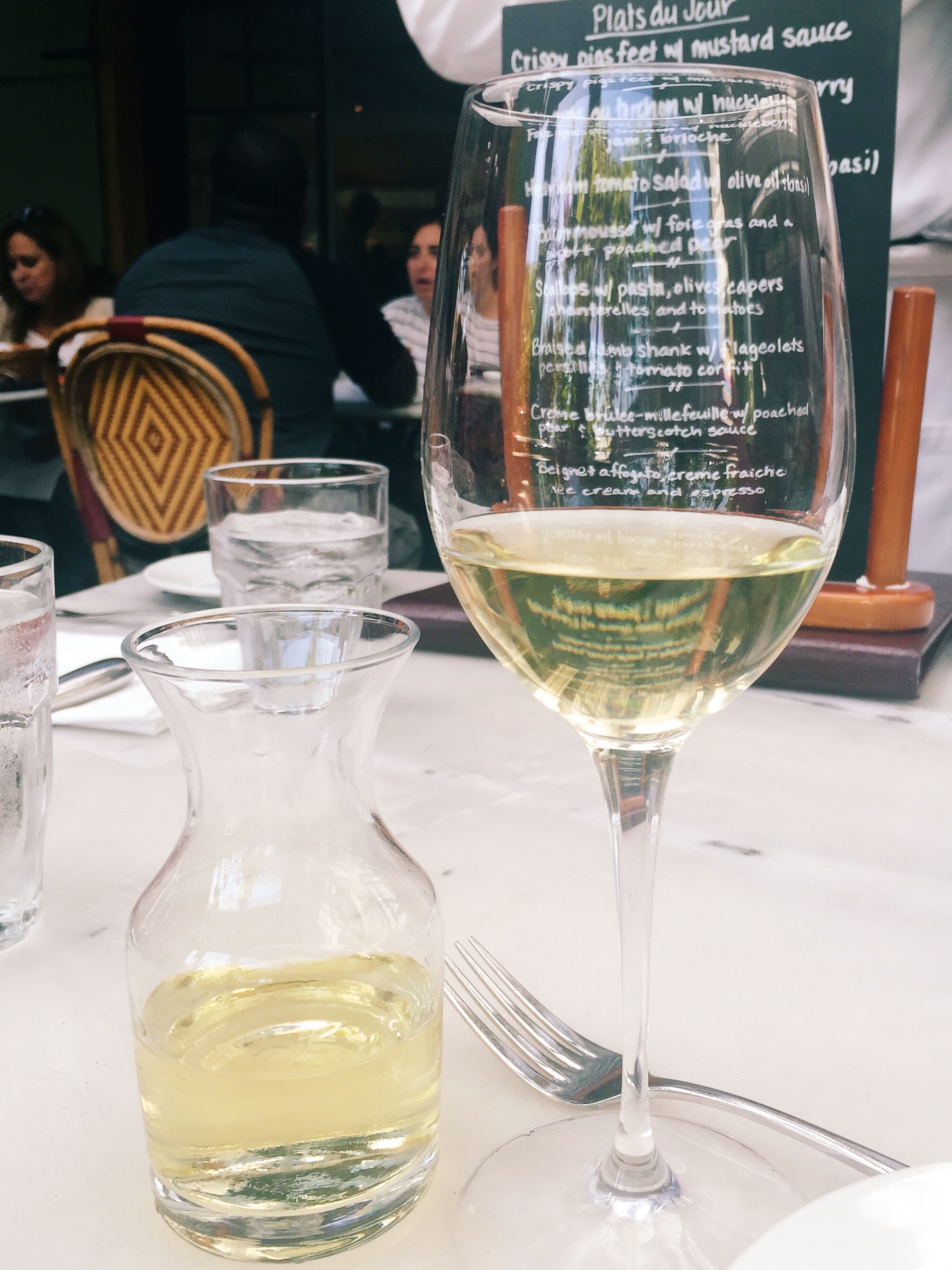 My favorite combo: a glass of excellent white wine and Bistro Jeanty . 