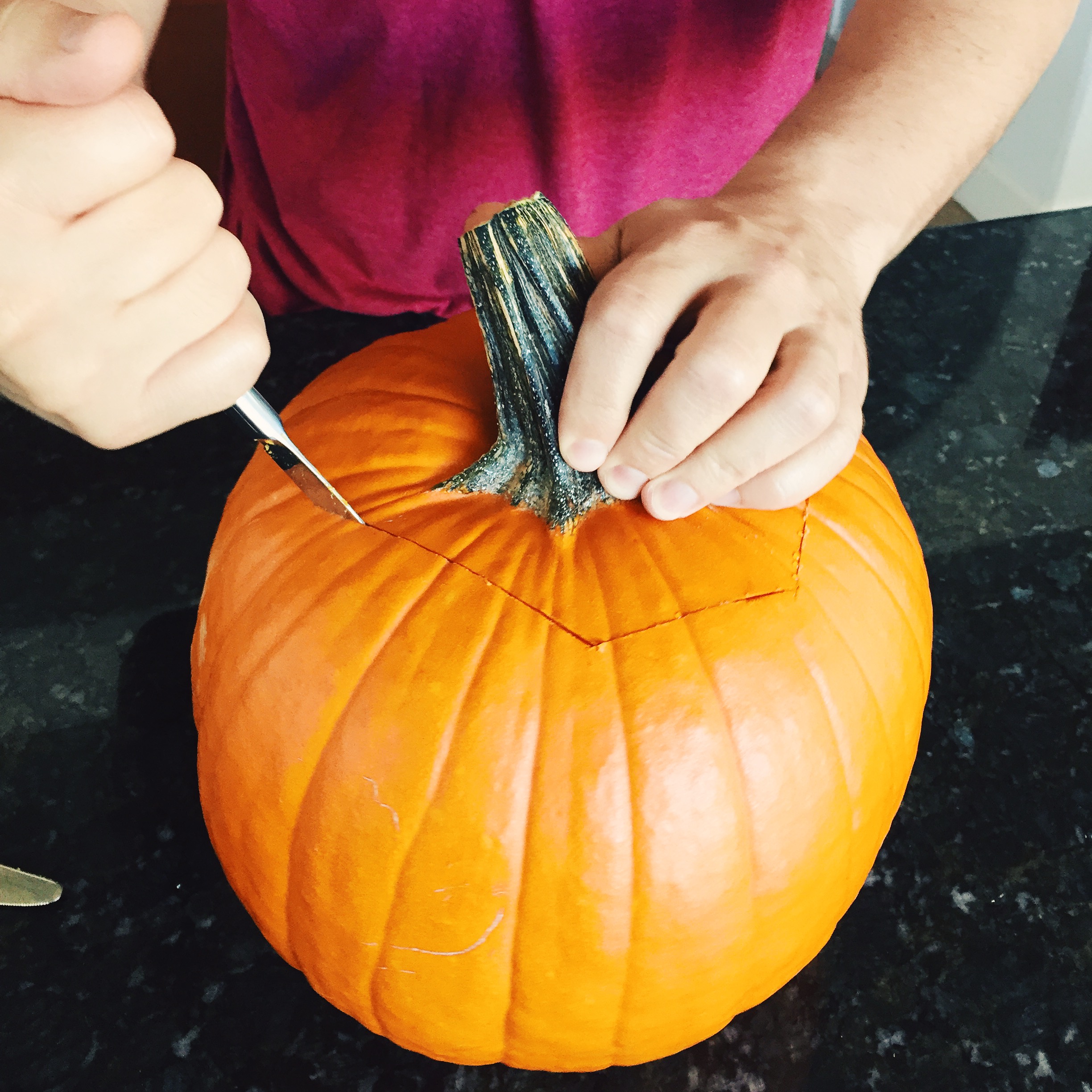 Clean outside of pumpkin. Cut a circle around pumpkin stem in order to stuff. I'm super clumsy with knives but found this super handsome guy to help me (don't tell my husband).