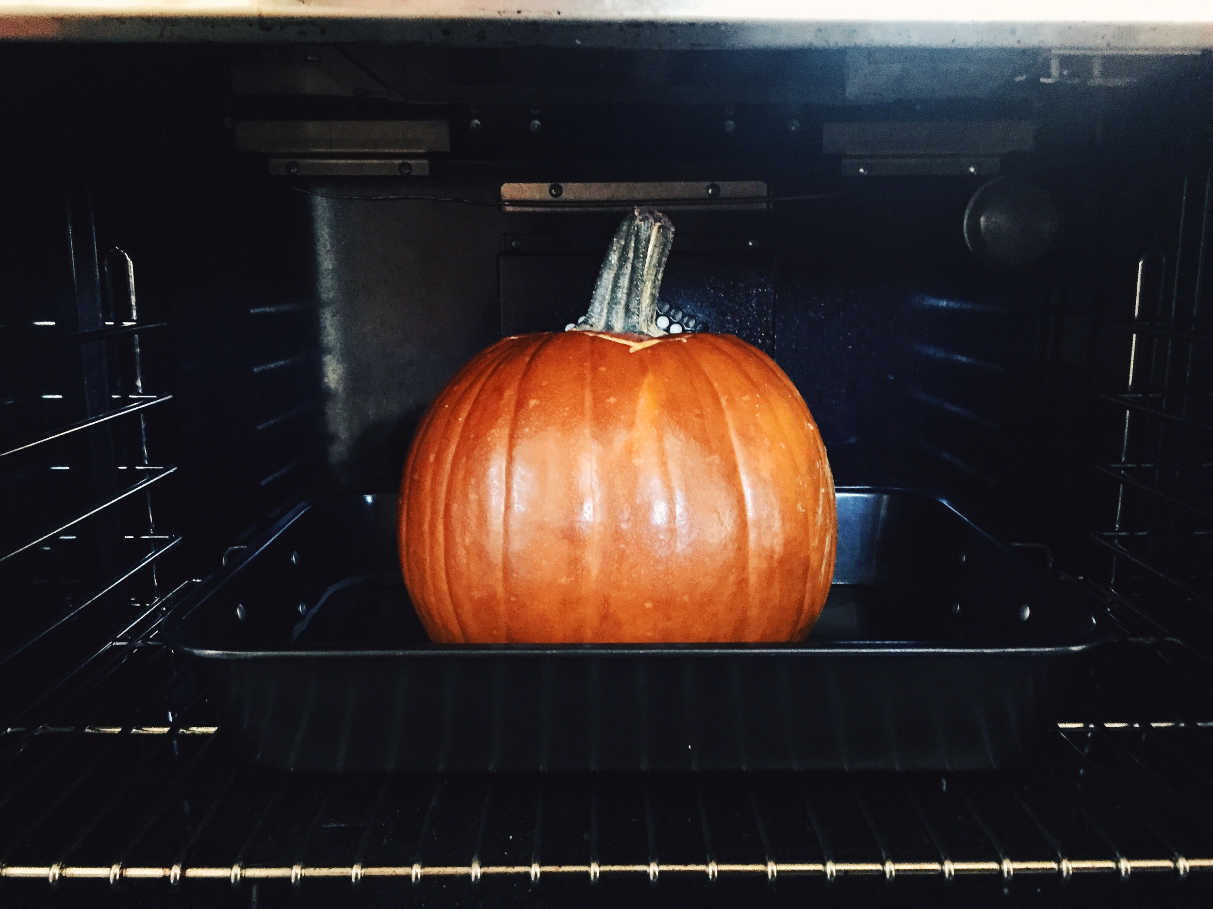 Half way. Check pumpkin frequently to be sure there is always water in the pan