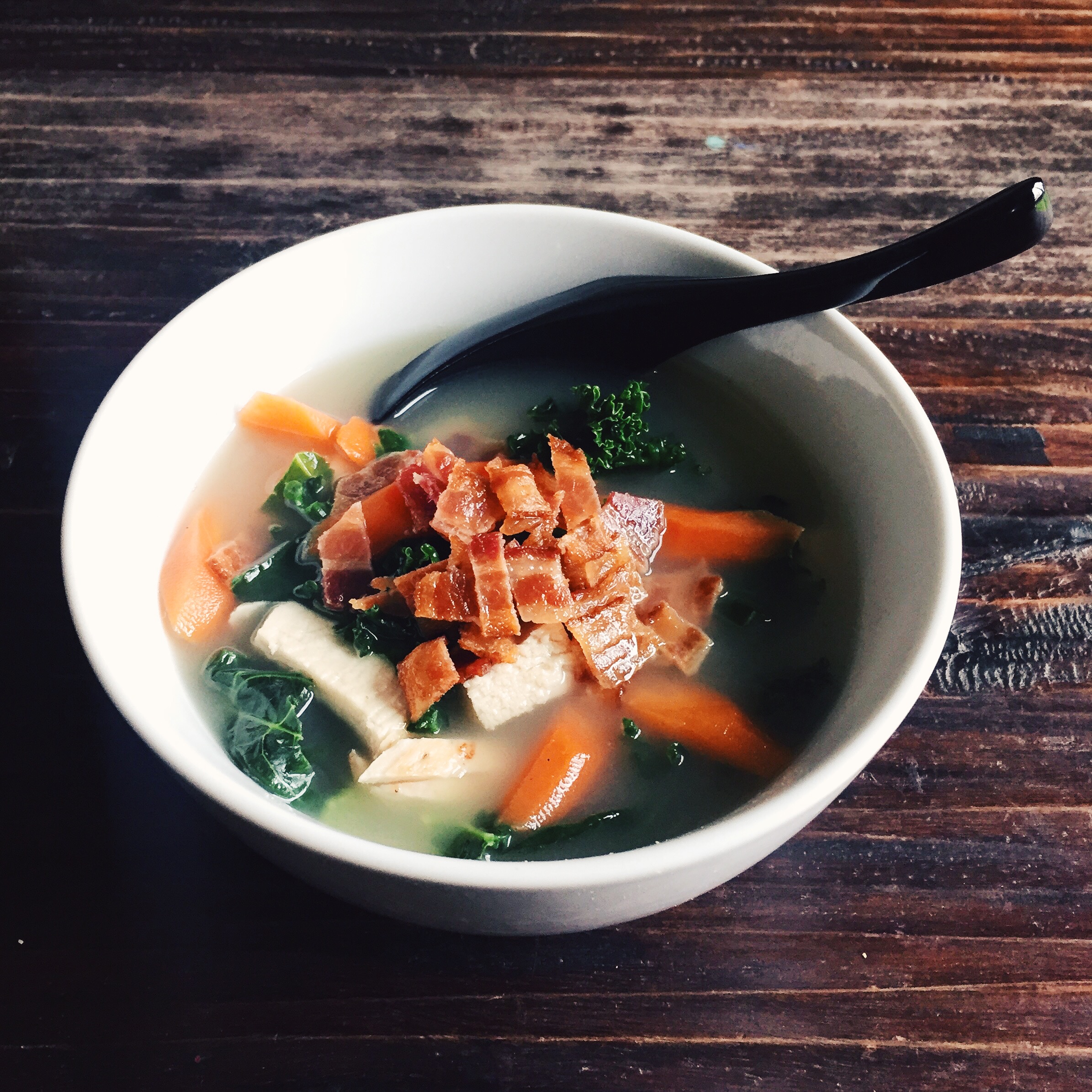 I used whatever left I had in the fridge to make this vegetable and chicken soup. Boil 2 cups of chicken broth then add your veggies and protein. A pinch of salt, white pepper, ginger or whatever seasoning you like. Topped with some cooked bacon.