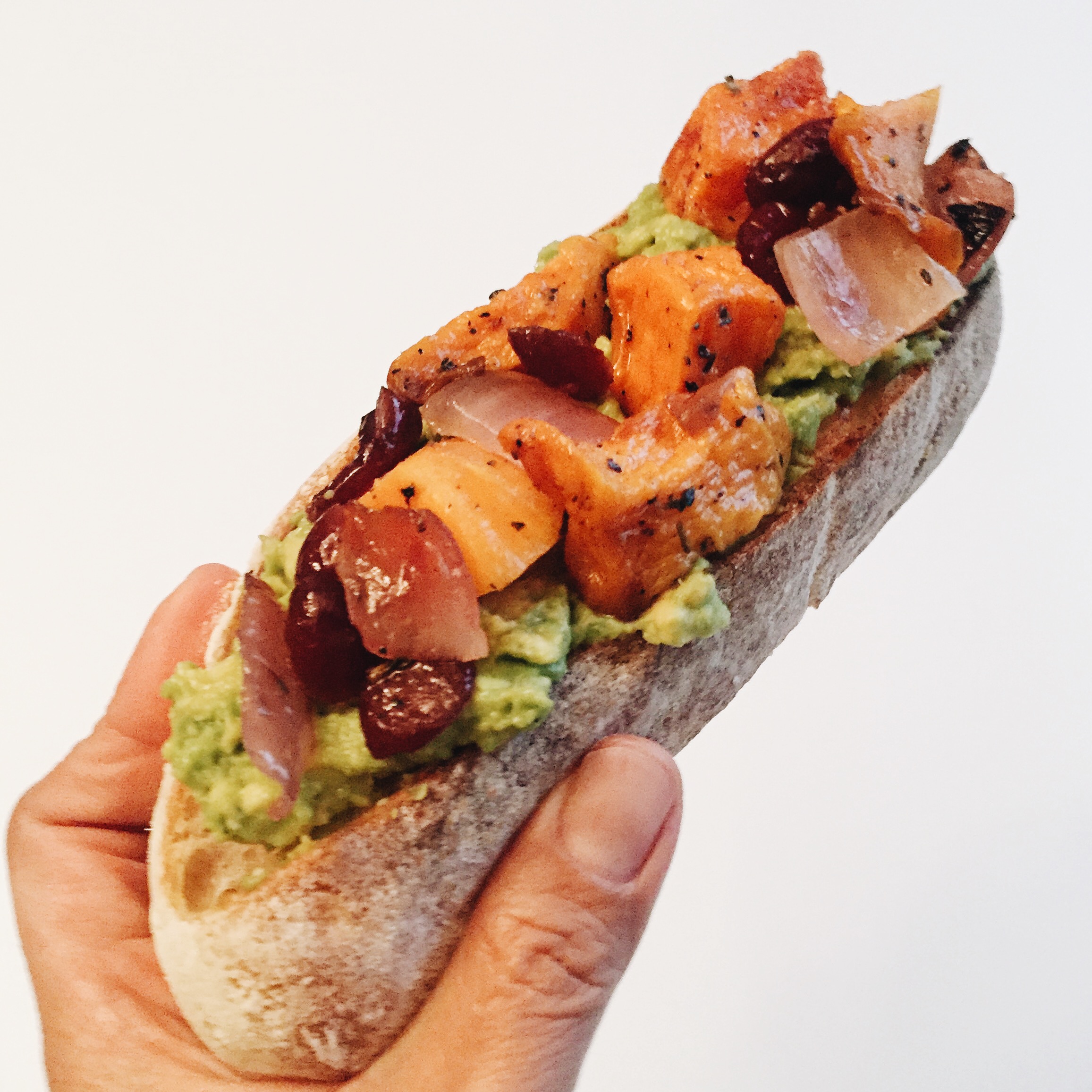 Mid morning snack: avocado toast with roasted butternut squash, cranberries, and red onion.