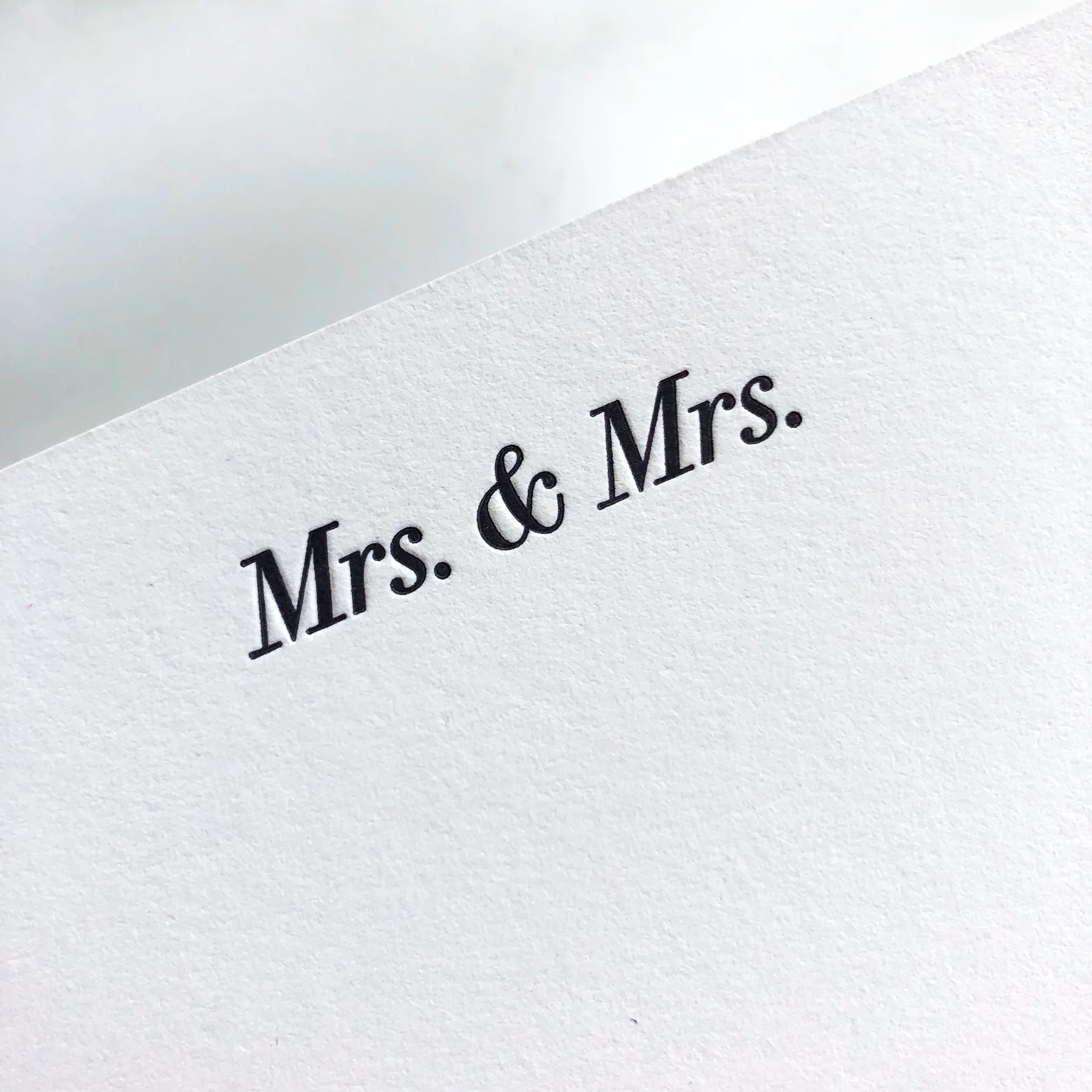 Type-A-Invitations-Mrs-Mrs-Closeup-Letterpress-WhiteMarbleBG.jpg