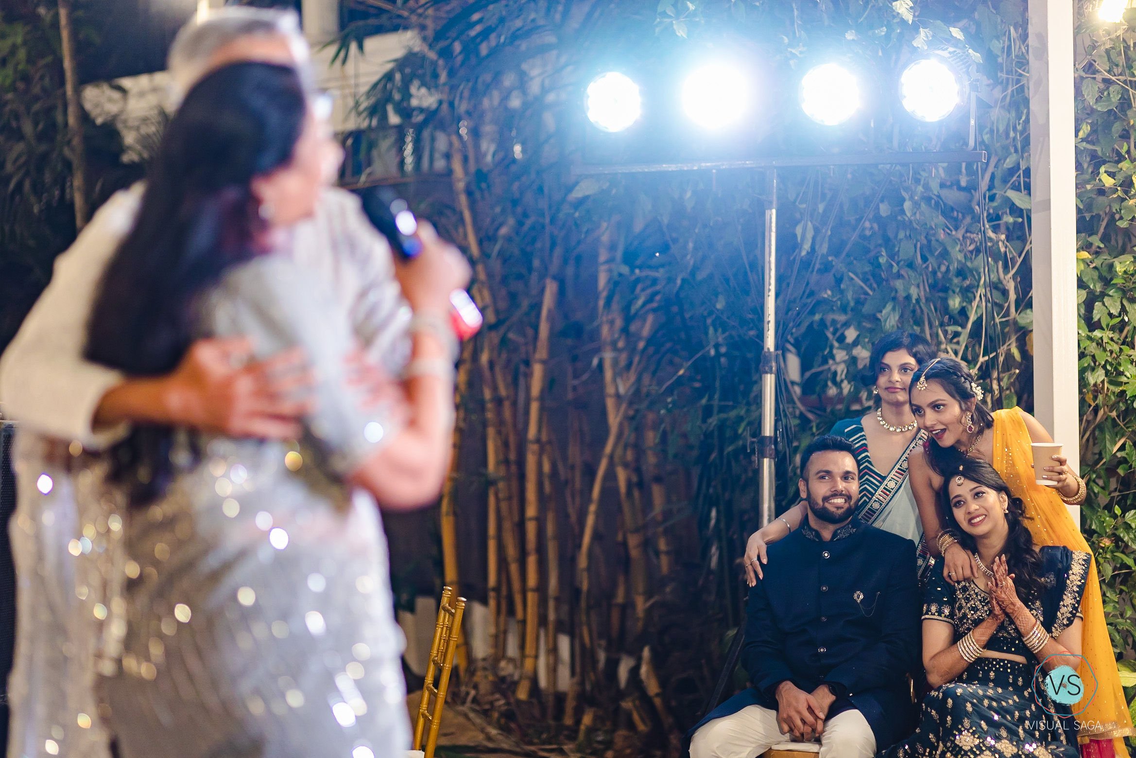 Visual Saga - best wedding photographers in bangalore and pune - emotional bride seeing her parents sing during sangeet.jpg