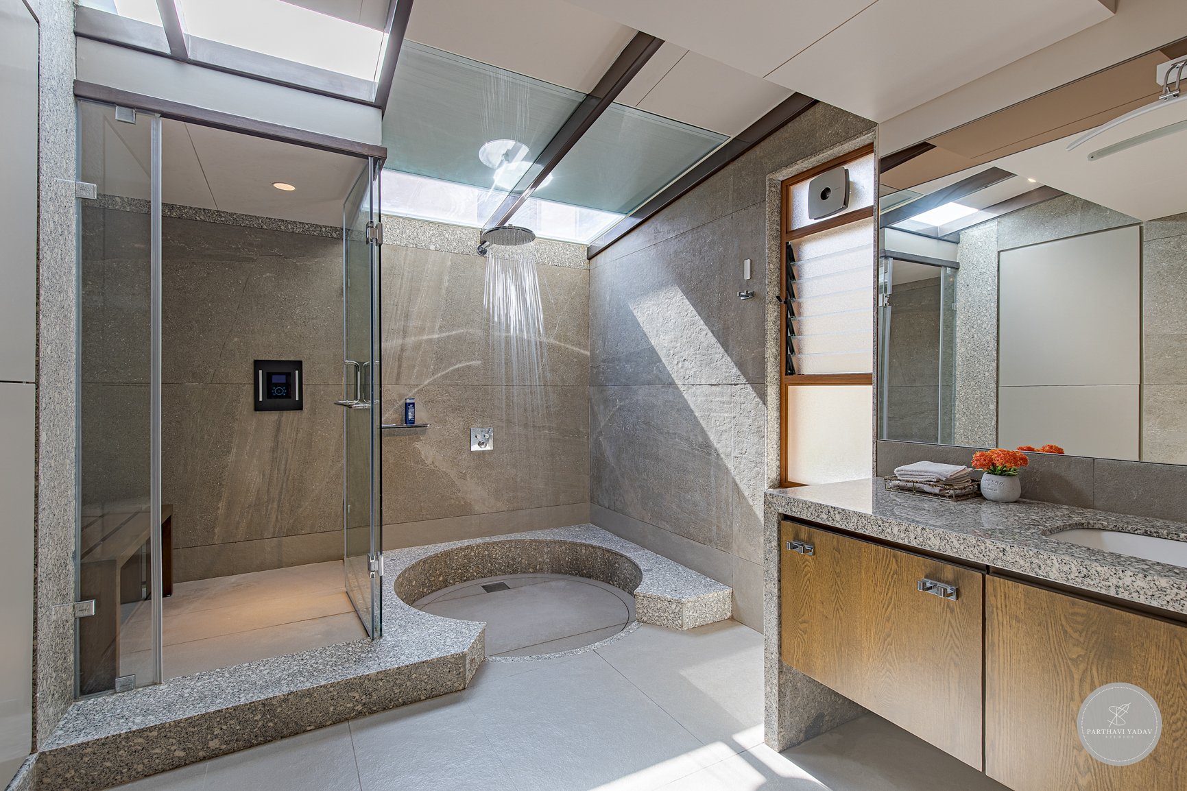 best interior photographer in pune bangalore - master bathroom with glass ceiling with shower and indoor sauna and sink made of marble.jpg