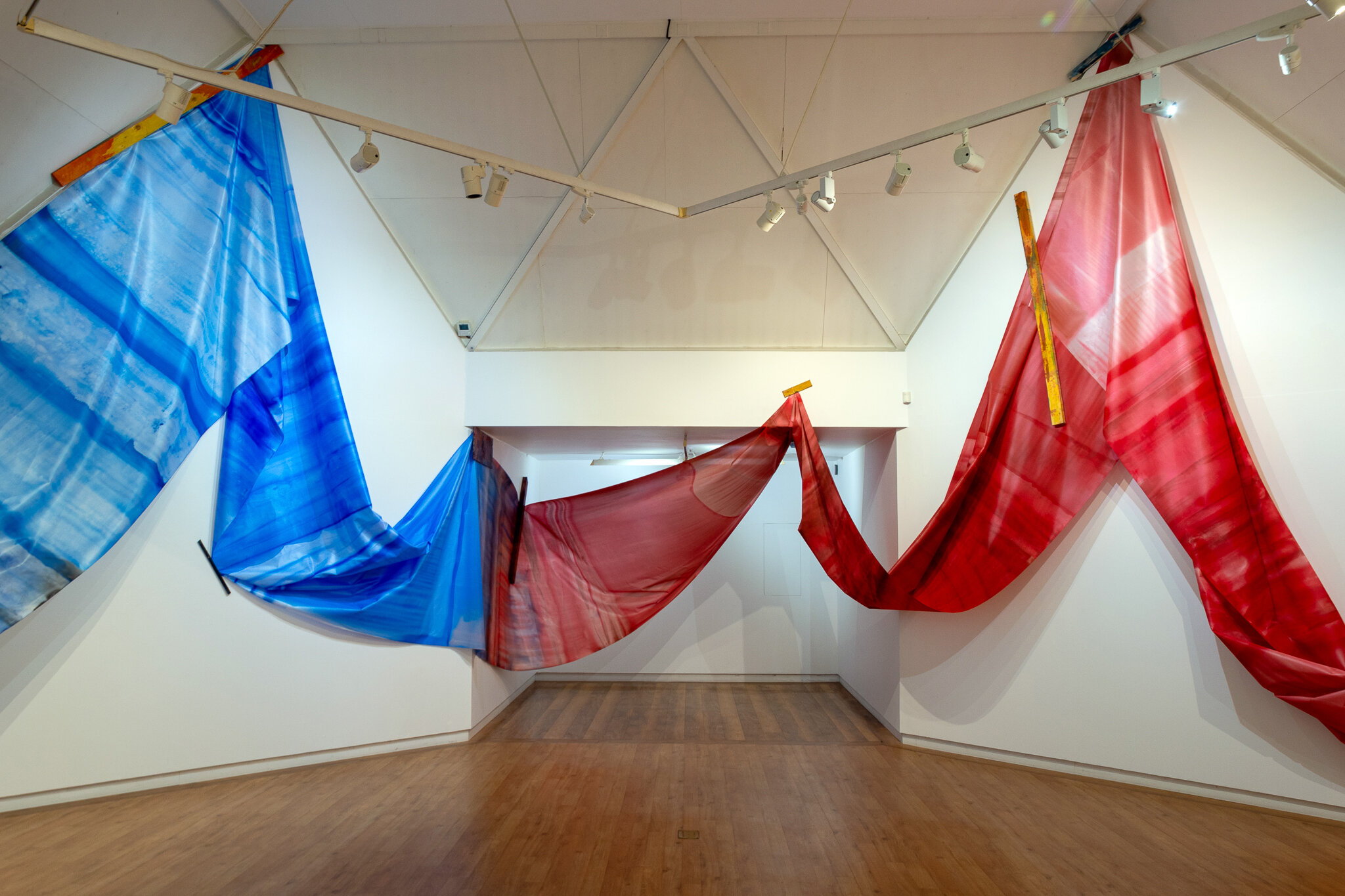   Recto / Verso  2020  acrylic pigment solution on knitted polyester fixed with wood  50m in length Hastings City Art Gallery 