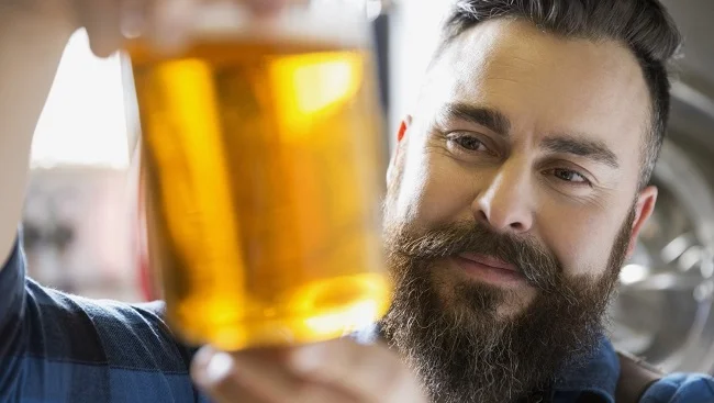 Is this man a beer snob? Who knows?