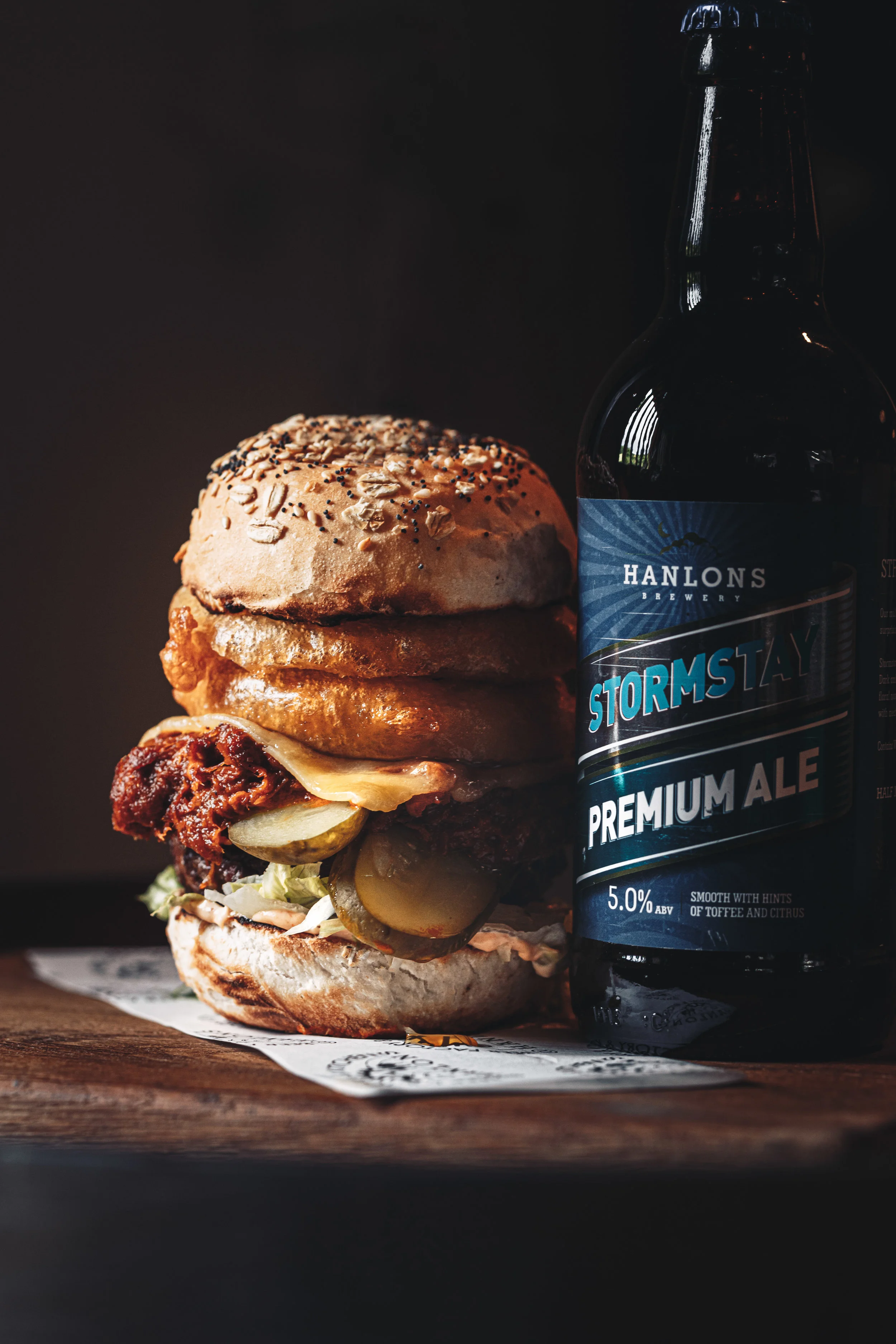 Food photography of a home made beef burger and local stout beer in North Devon shot by Somerset based food photographer Faydit Photography
