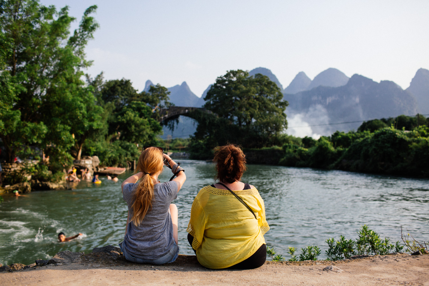 Christina and her mom Karen enjoying a serene sunset at Fuli bridge.