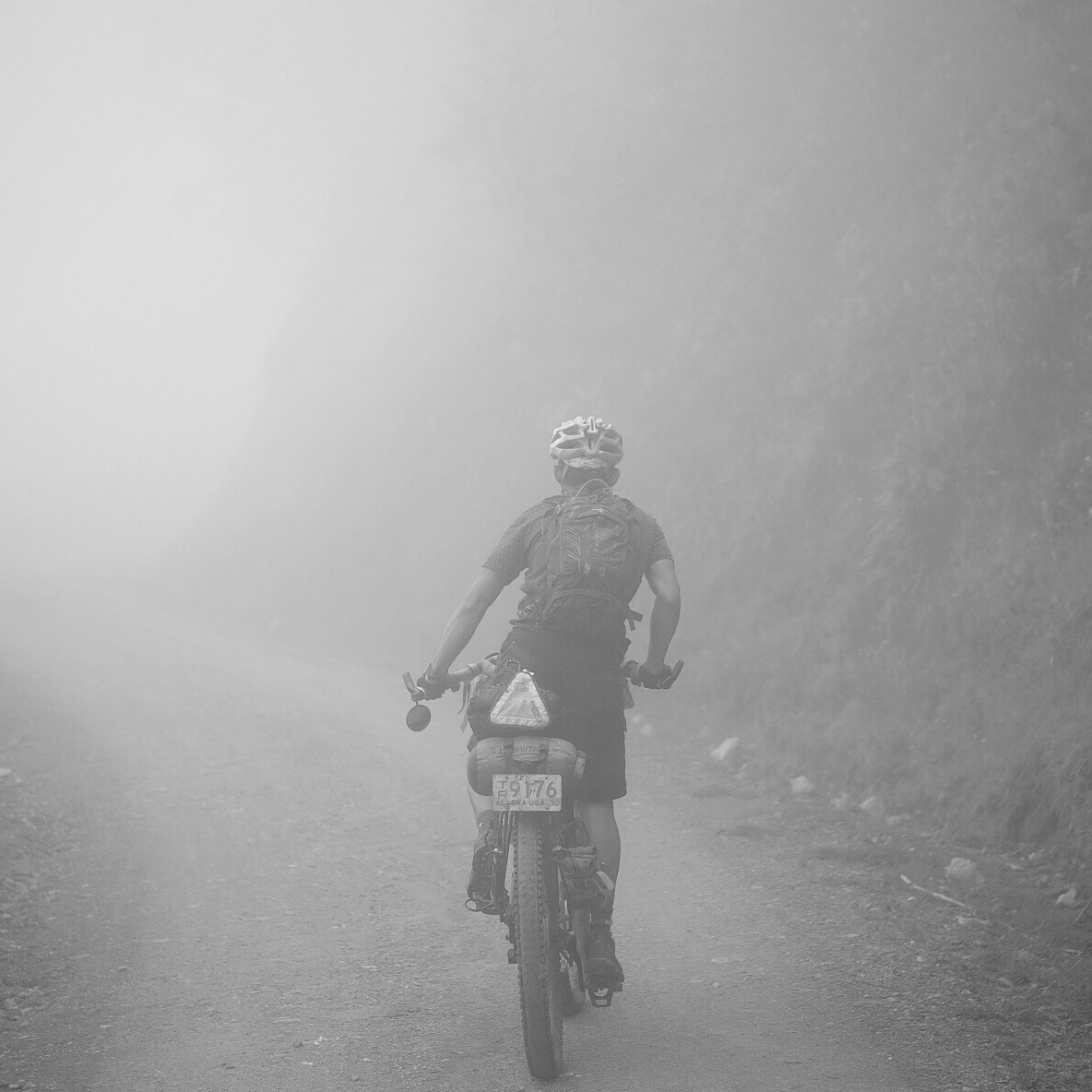 Dean going through the mist during our 20km climb on the way to Toche.