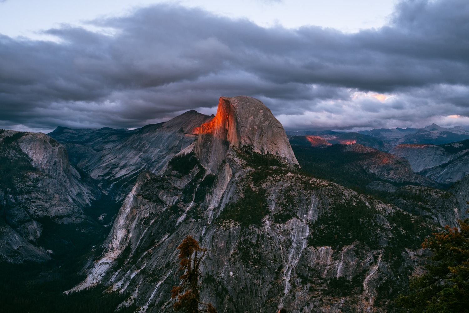 Half Dome painted in red by the warm rays of sunlight 