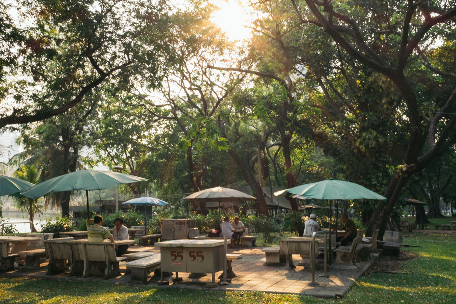 Men playing chess in a park in downtown Bangkok