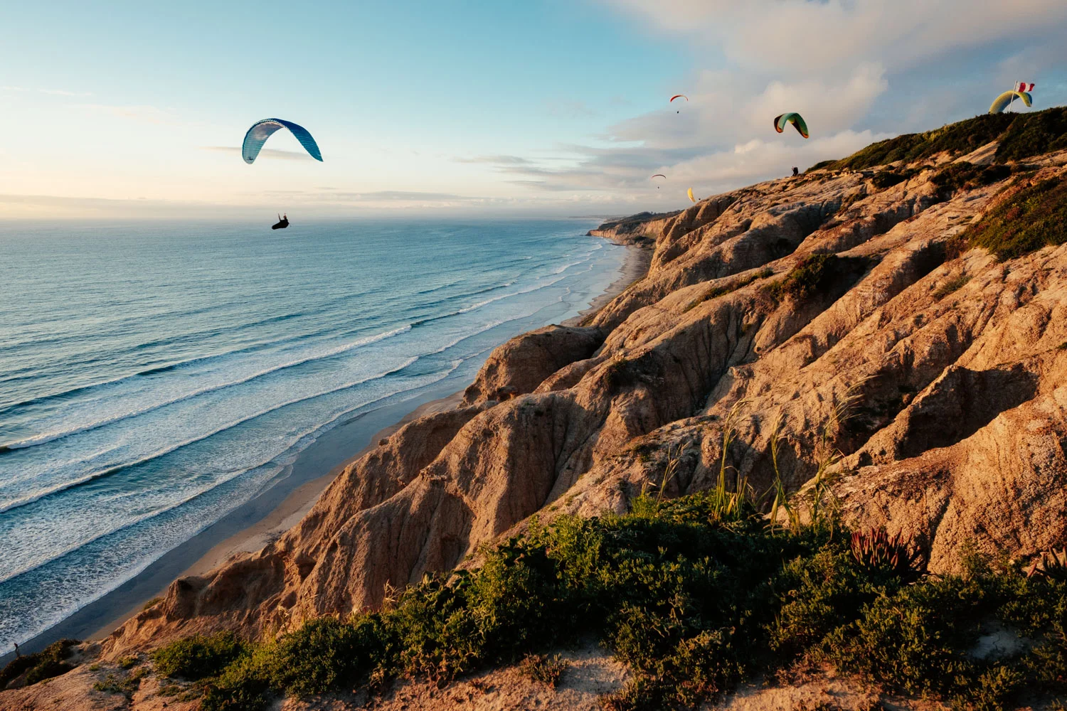 Paragliders flying above Torrey Pines State Reserve, San Diego, CA. 