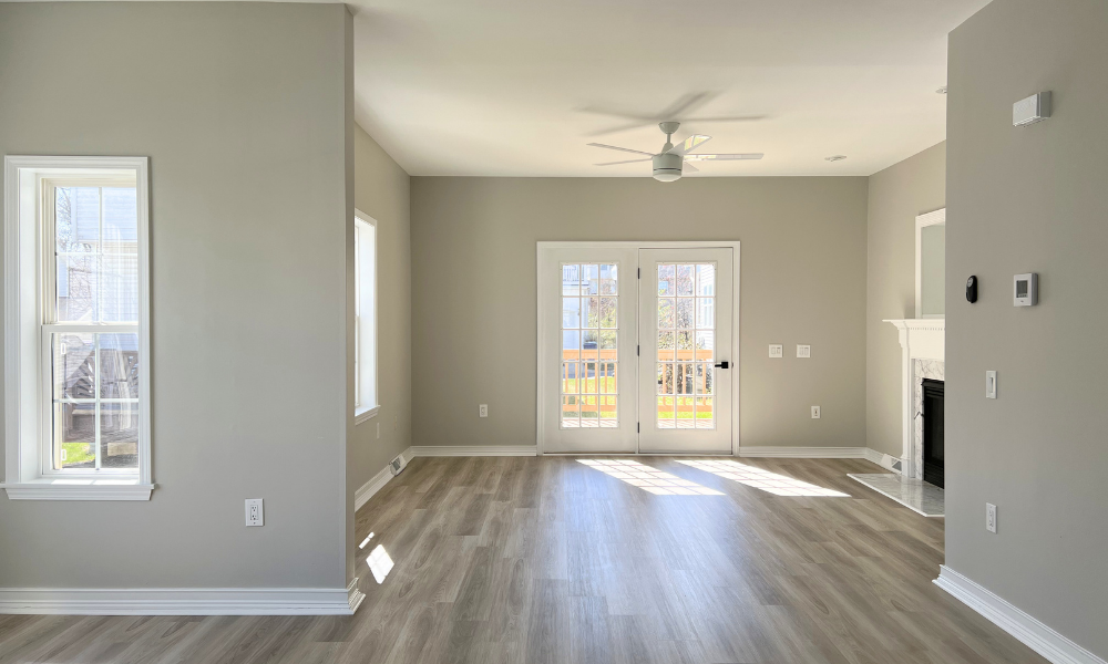 •	Living room after flooring and lighting updates, Howard County MD home sale