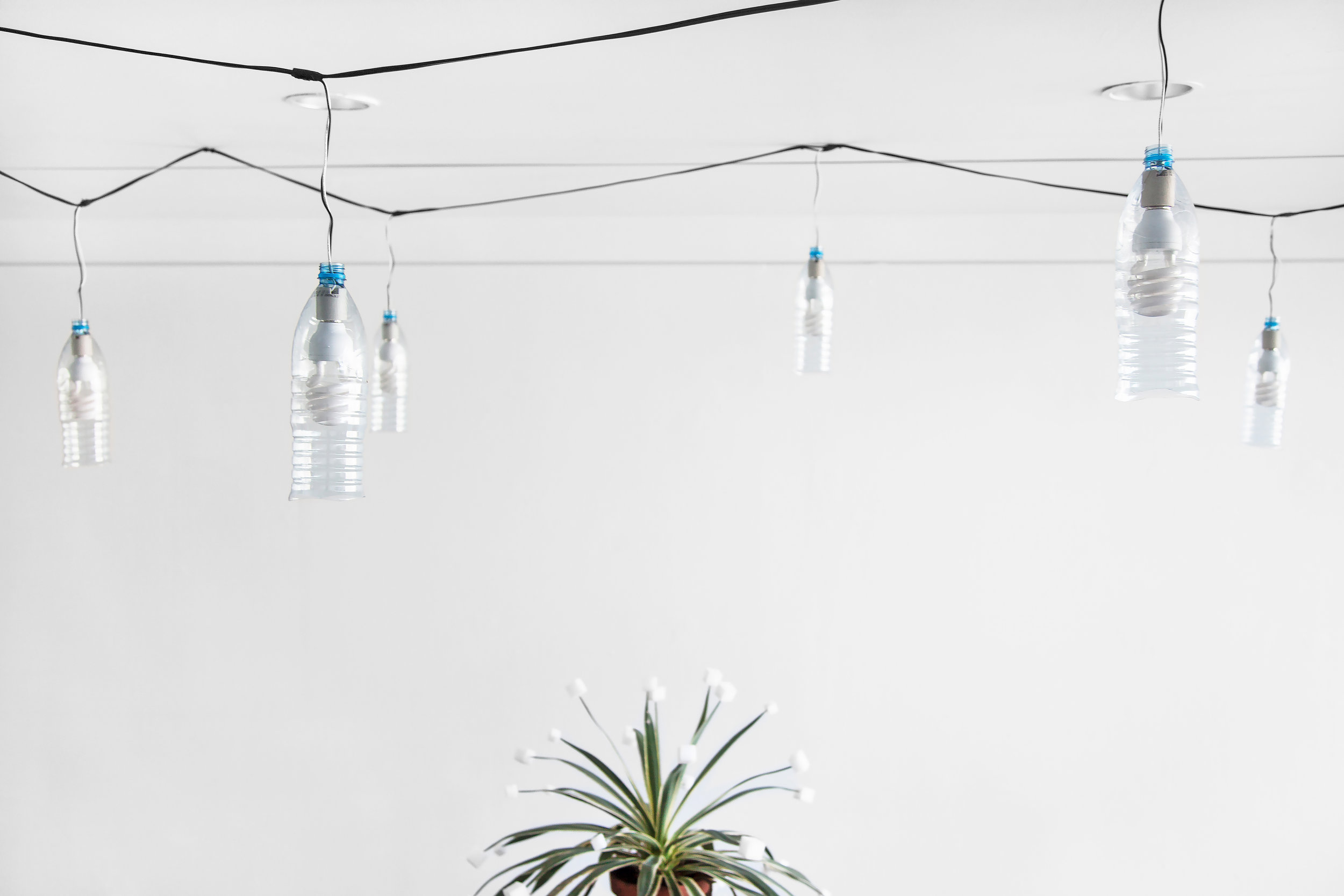 String of Sohat , 2014, 22 Sohat water bottles, 22 60W daylight bulbs, weather proof cable/ plug, 48' (576" long, 14.6 m)