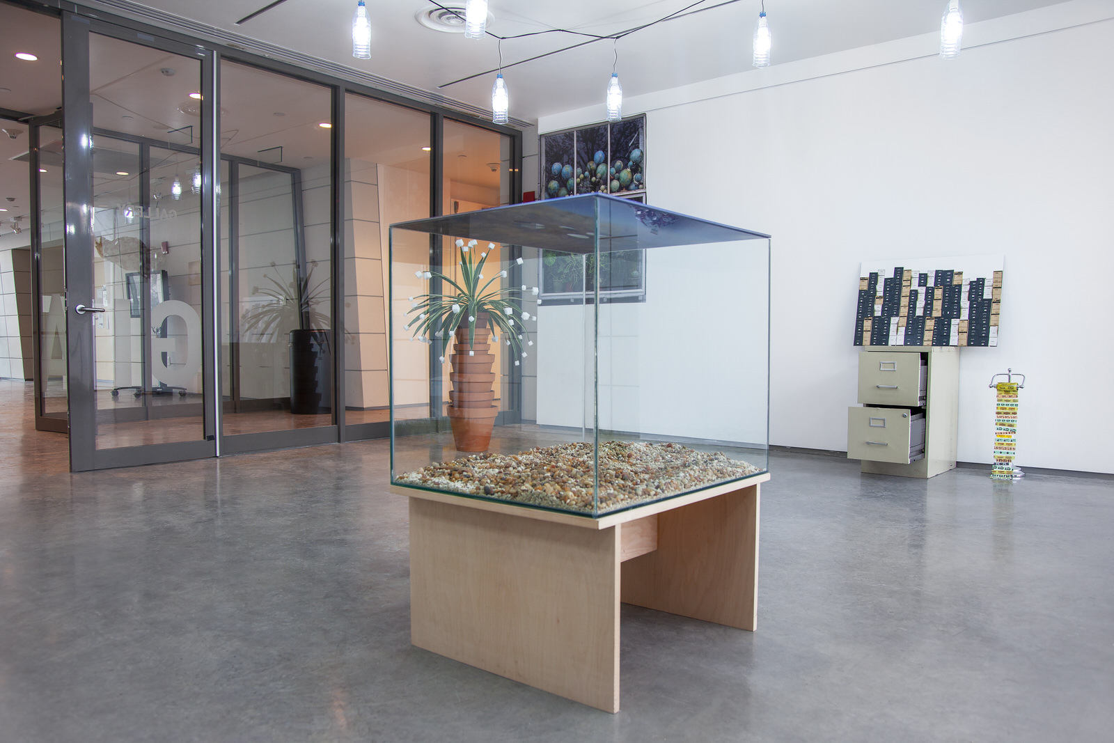 Laqlouq Lakes II , 2014, double-sided digital c print sandwiched in plexiglass, hydrophobic coating, water (replaced daily), glass terrarium, gravel, birch wood base, 30"x 24"x 42" (61 cm x 76.2 cm)