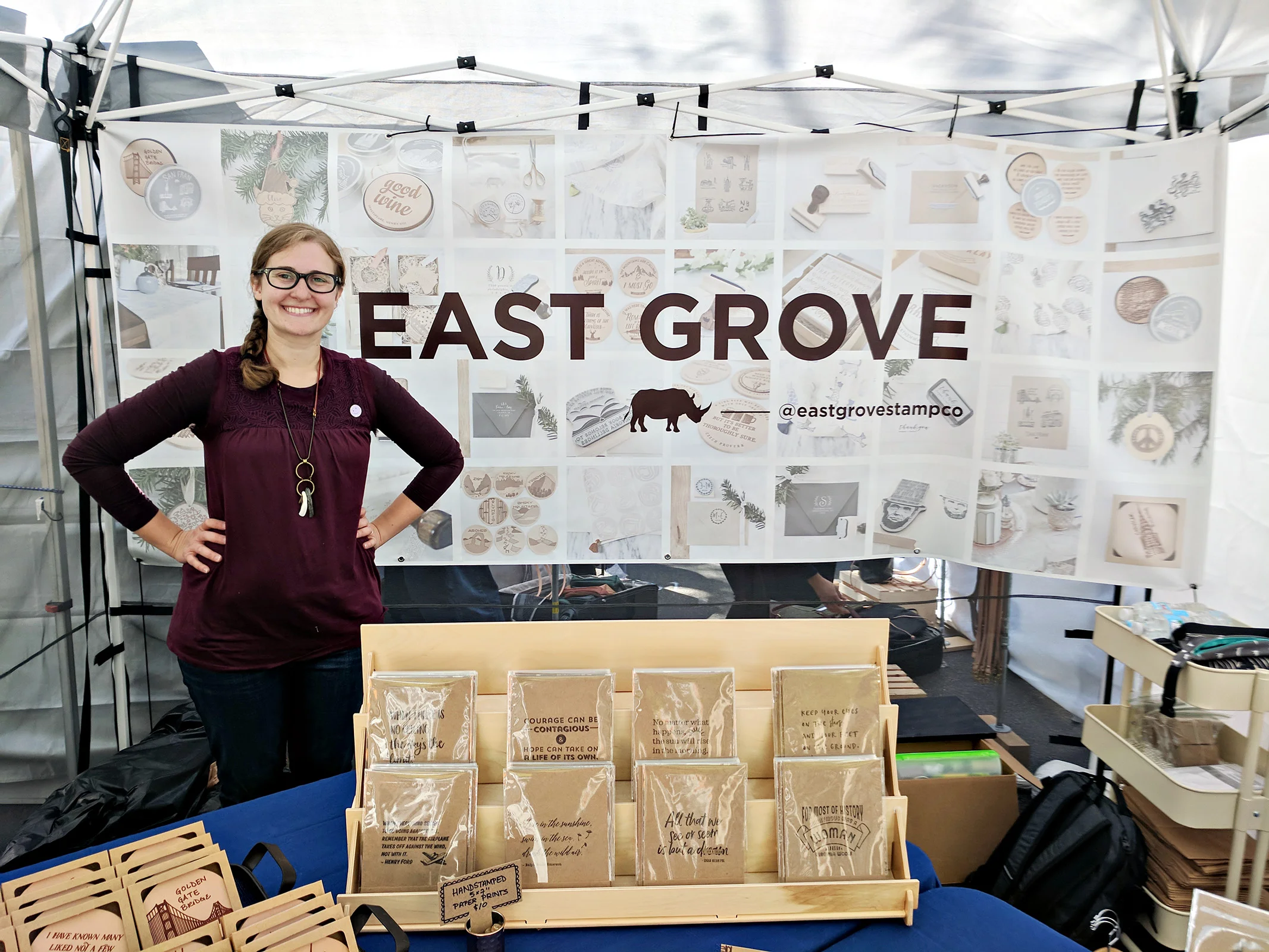 Sydney Musselman from East Grove Stamp Co. inside her craft show booth at The Renegade Craft Fair in Chicago