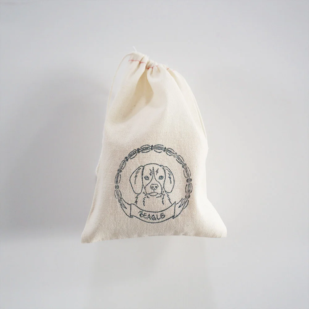 Cotton parts bags are inexpensive, rustic, and the perfect wrapping for small gifts (such a homemade stamped ornaments….)