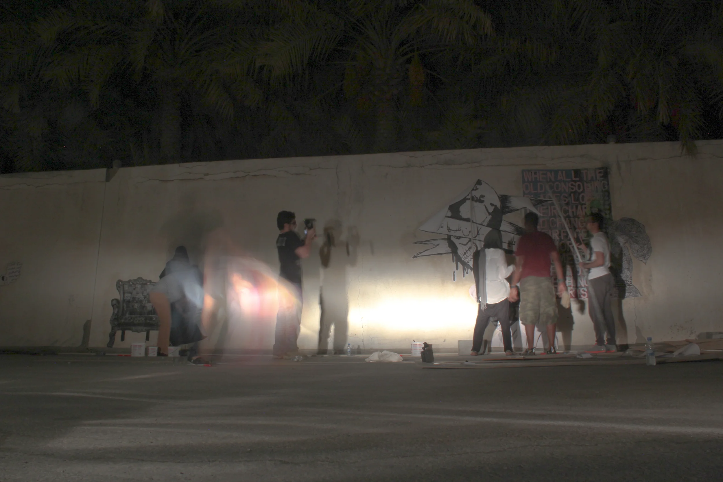 The "paste it" group working on their collective mural