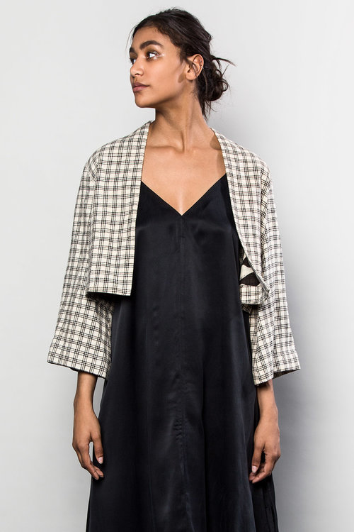 An Asiatica favorite is this one-of-a-kind Temple Jacket in Japanese White and Black Cotton Grid , lined with a graphic black and white printed Indian cotton. $1,595