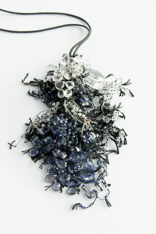 Another one-of-a-kind gem is by artist Kaname Higa . This Dark Cluster Necklace is a glorious bundle of Moonstone, Crystal, Tanzanite, Pearls and Topaz beads on a long black cord. $3,500