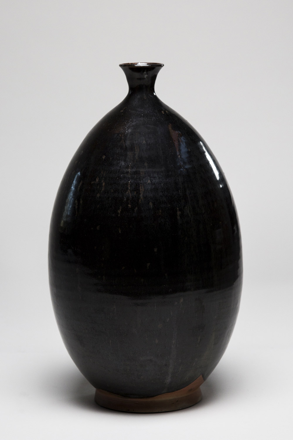 This is a pure beauty that mother will appreciate; a Korean 20th century Large Ovoid Glazed Stoneware Vase standing 16.5 inches tall. $145
