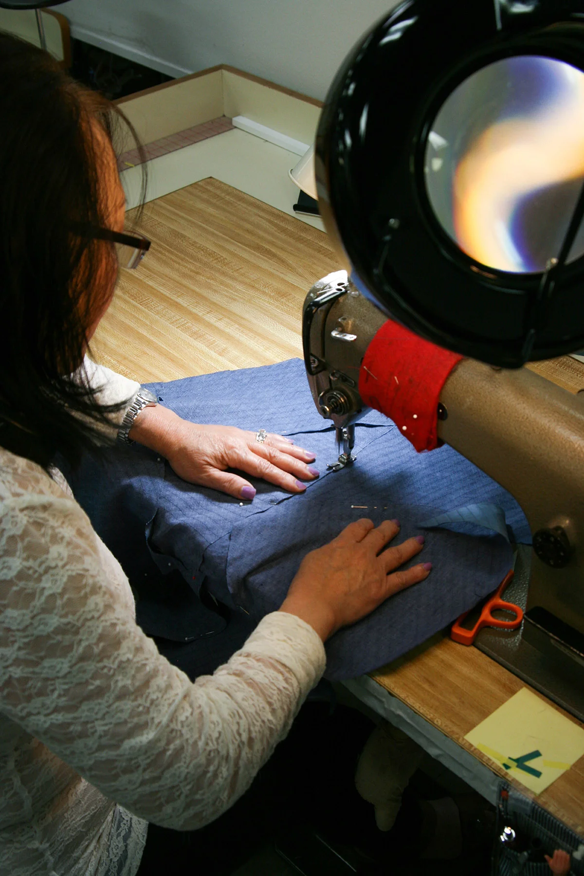 Each garment piece is then stitched together along the edges of the raw pieces.