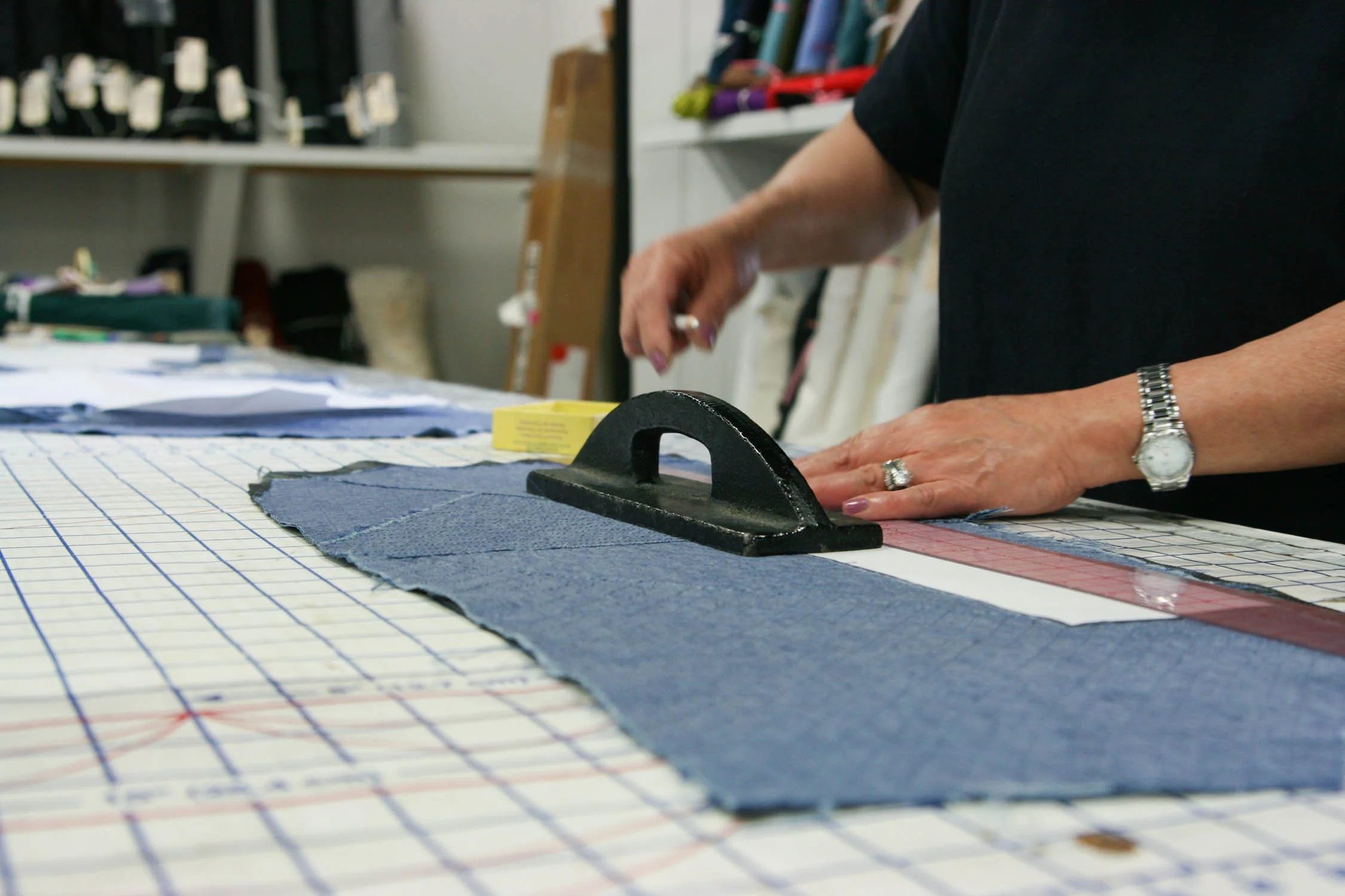 Cutting the final garment pieces out using pattern weights, a clear ruler and marking pencil.