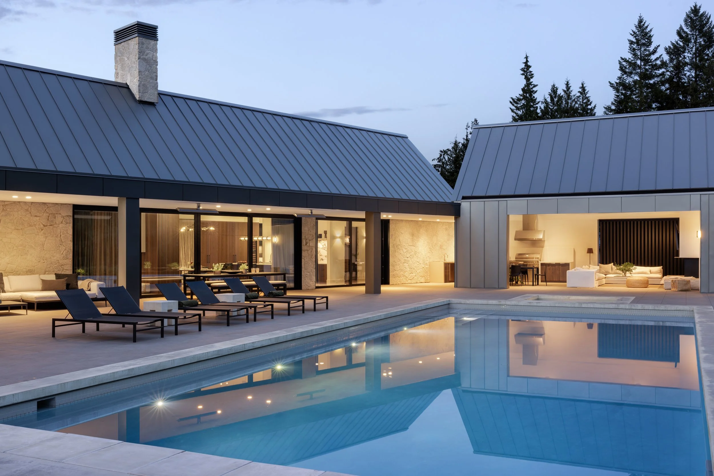  “Set on a large, flat lot above the Capilano River, with broad views of the mountains and flanked by old-growth forest, the location for this single-level, five-bedroom-plus-guest-suite family home served as a crucial cue for its redevelopment. “The