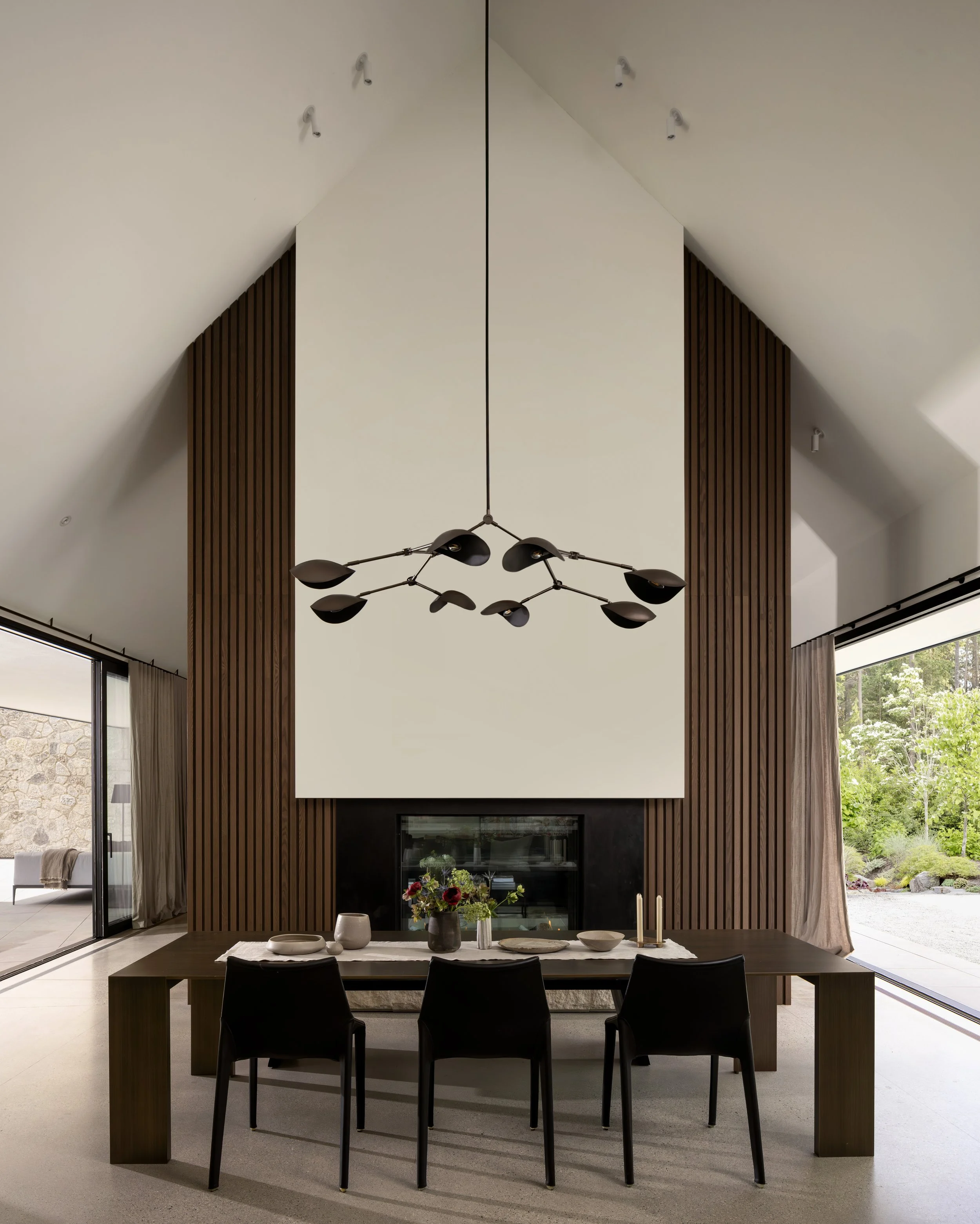  The kitchen can accommodate long table dinners as well as casual get togethers at the kitchen island, with the cozy fireplace for atmosphere during the cooler months.  