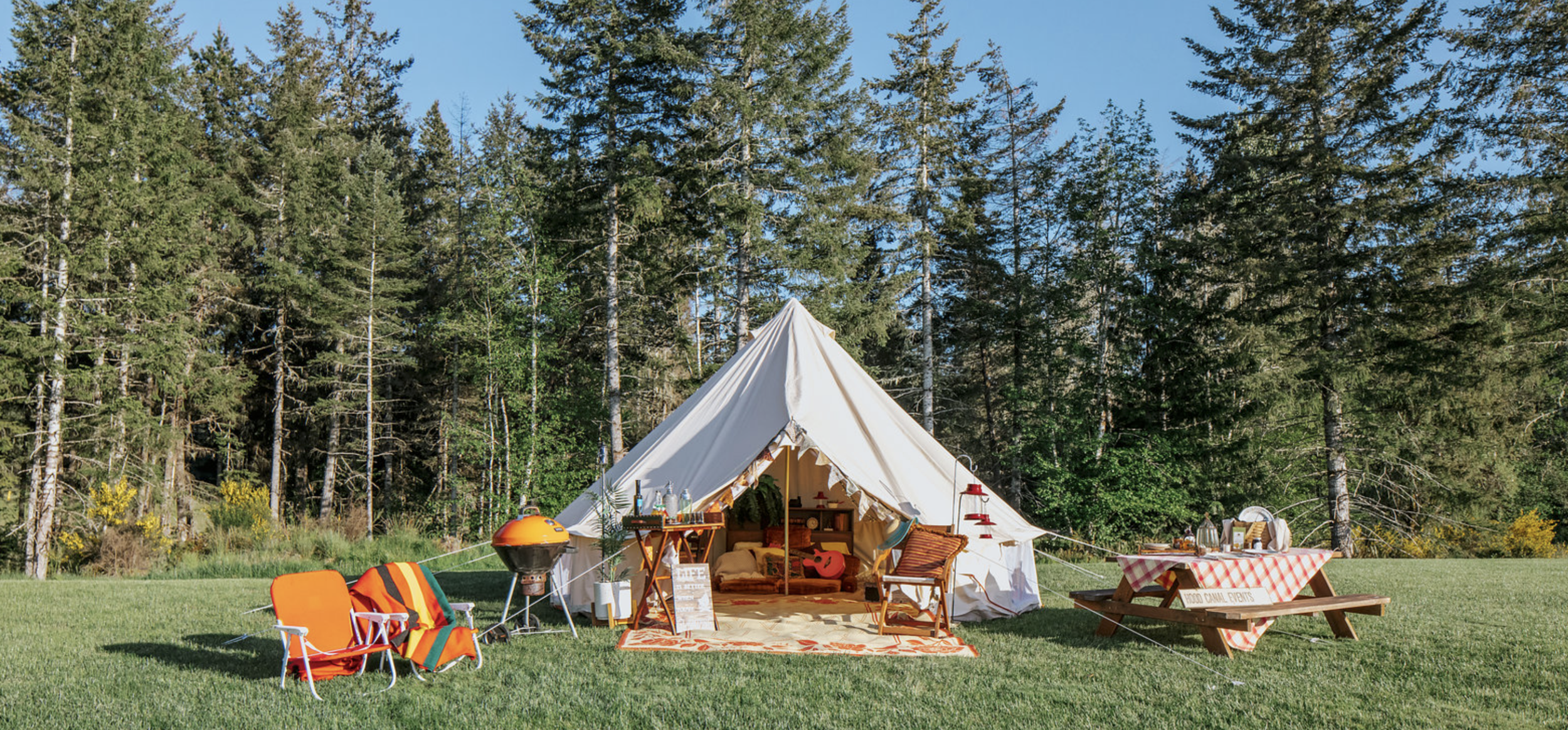 The ultimate "glamping" experience can be provided by Hood Canal Events located in Union, WA. For a fee they can arrange the perfect getaway for you and your signifigant other – or the whole family. From setting up the camp & tent (pictured above) in a spectacular location, arranging tours, hikes or kayaking expeditions, to chef prepared gourmet meals in your camp – Jeff and Kerry can take care of it all for you. Call them directly at (360) 710-7452 or visit hoodcanalevents.org. Photo Poppi Photography